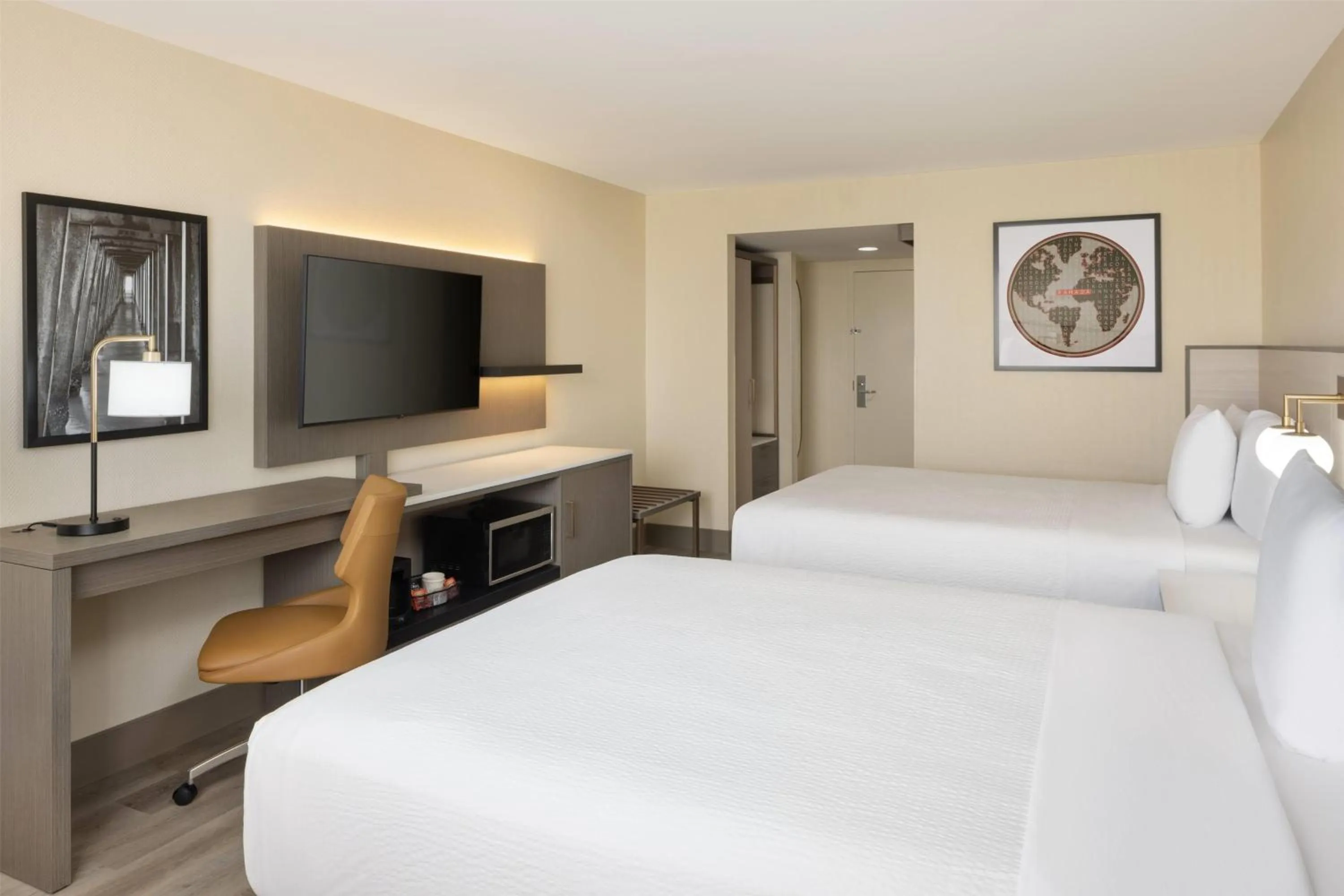 Photo of the whole room, Bed in Ramada Plaza by Wyndham Orlando Resort & Suites Intl Drive - Newly Renovated!