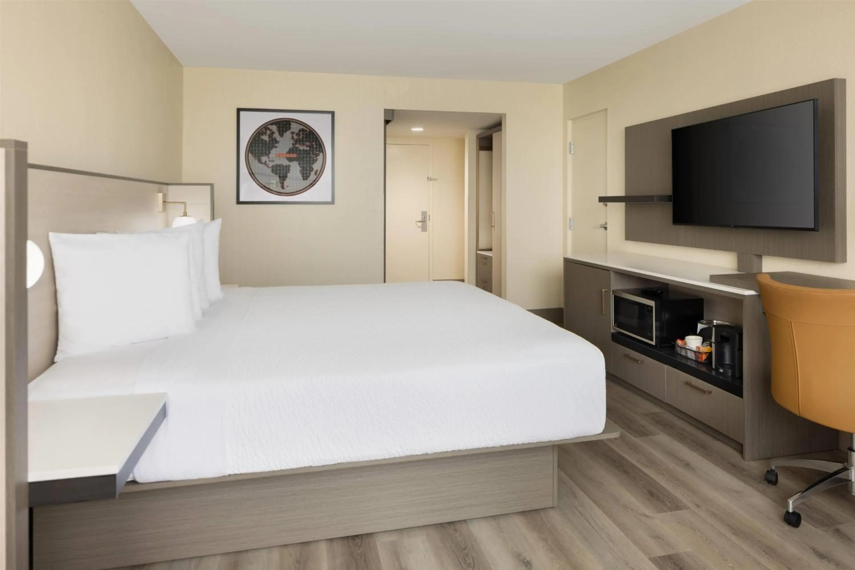 Photo of the whole room, Bed in Ramada Plaza by Wyndham Orlando Resort & Suites Intl Drive - Newly Renovated!