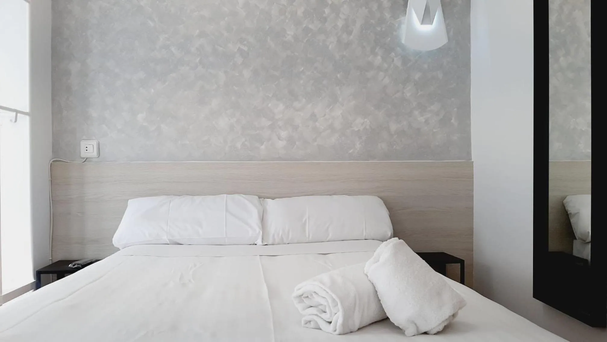 Bed in Hostal Lucia by gaiarooms