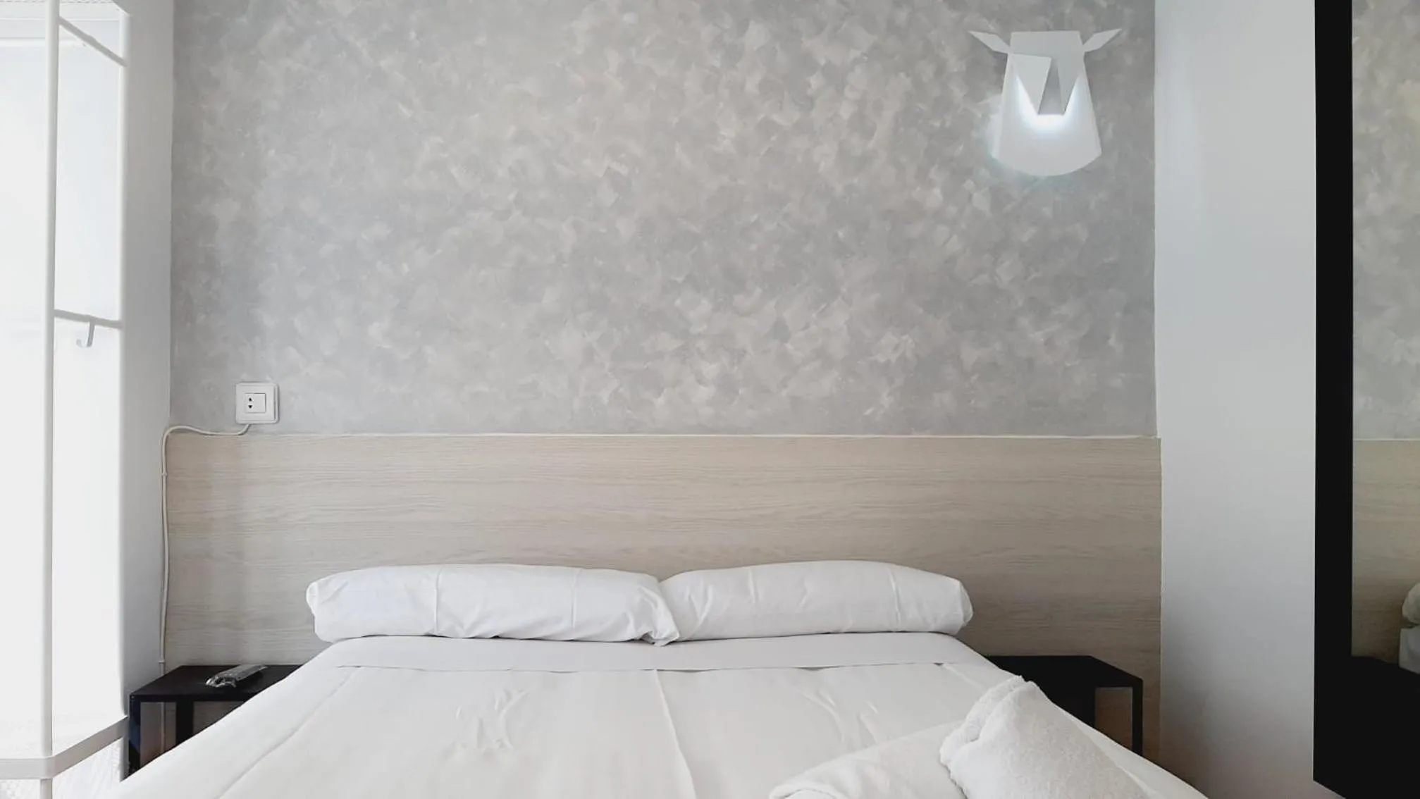 Bed in Hostal Lucia by gaiarooms