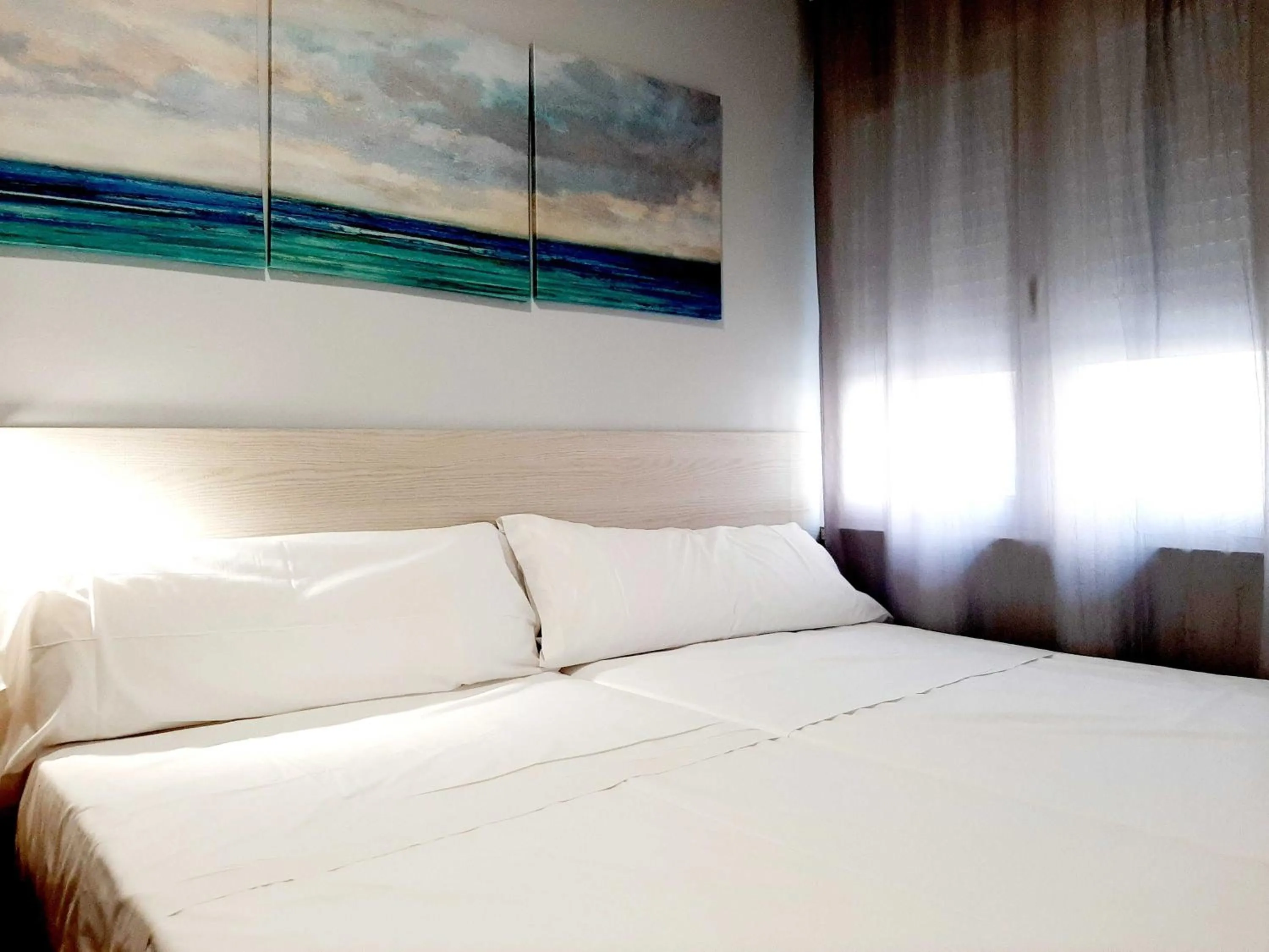 Bed in Hostal Lucia by gaiarooms