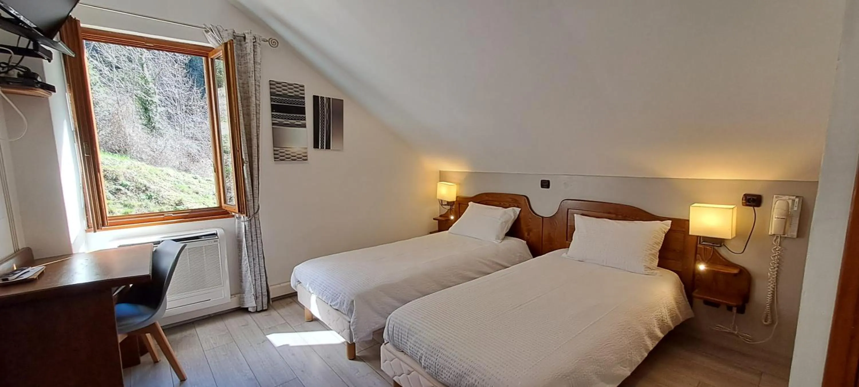 Bedroom, Bed in Logis Hôtel restaurant Auberge de la Cascade