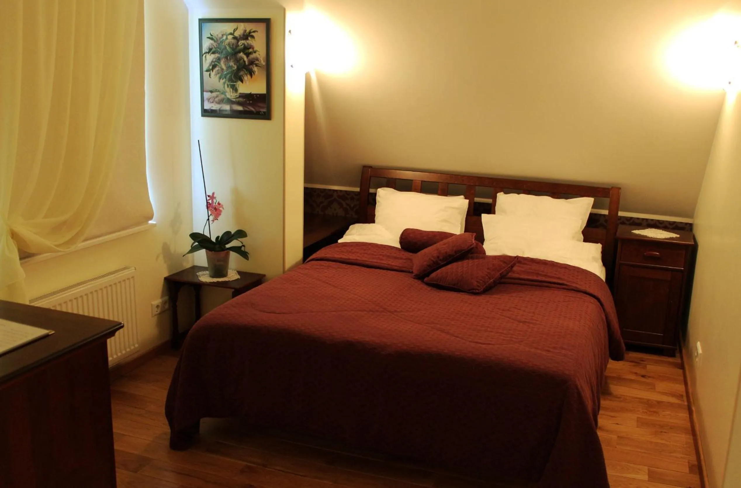 Bed in Embrace Hotel & Apartments