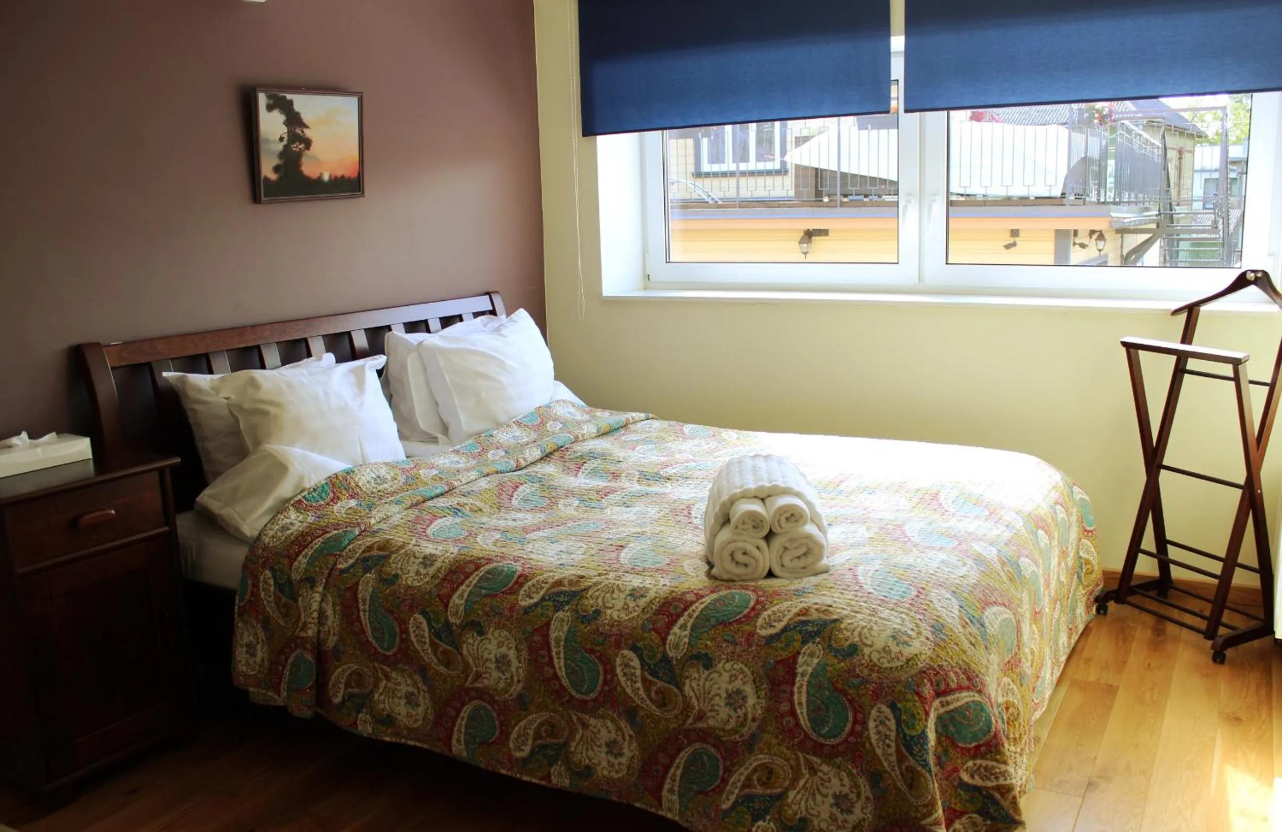 Bed in Embrace Hotel & Apartments