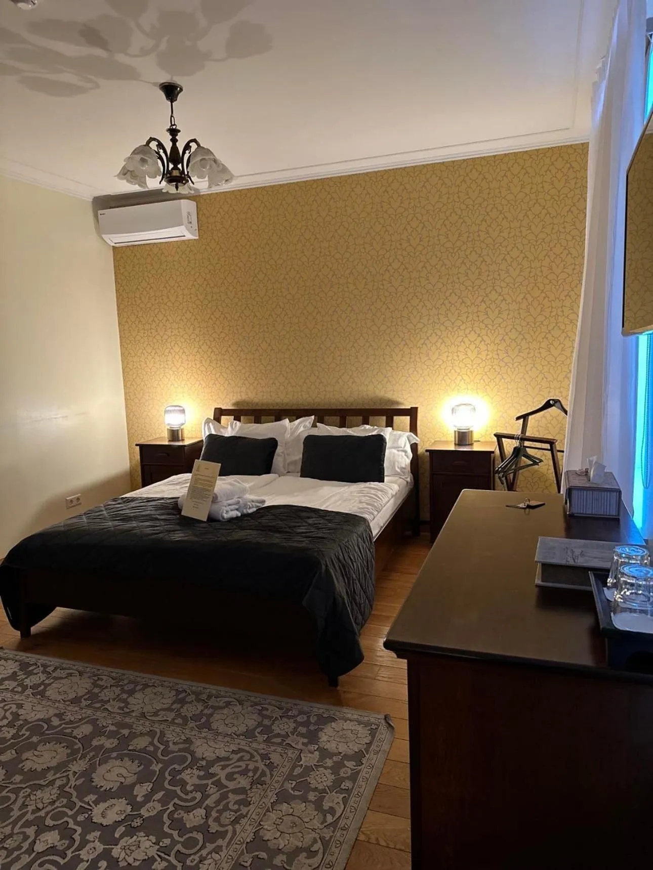 Bed in Embrace Hotel & Apartments