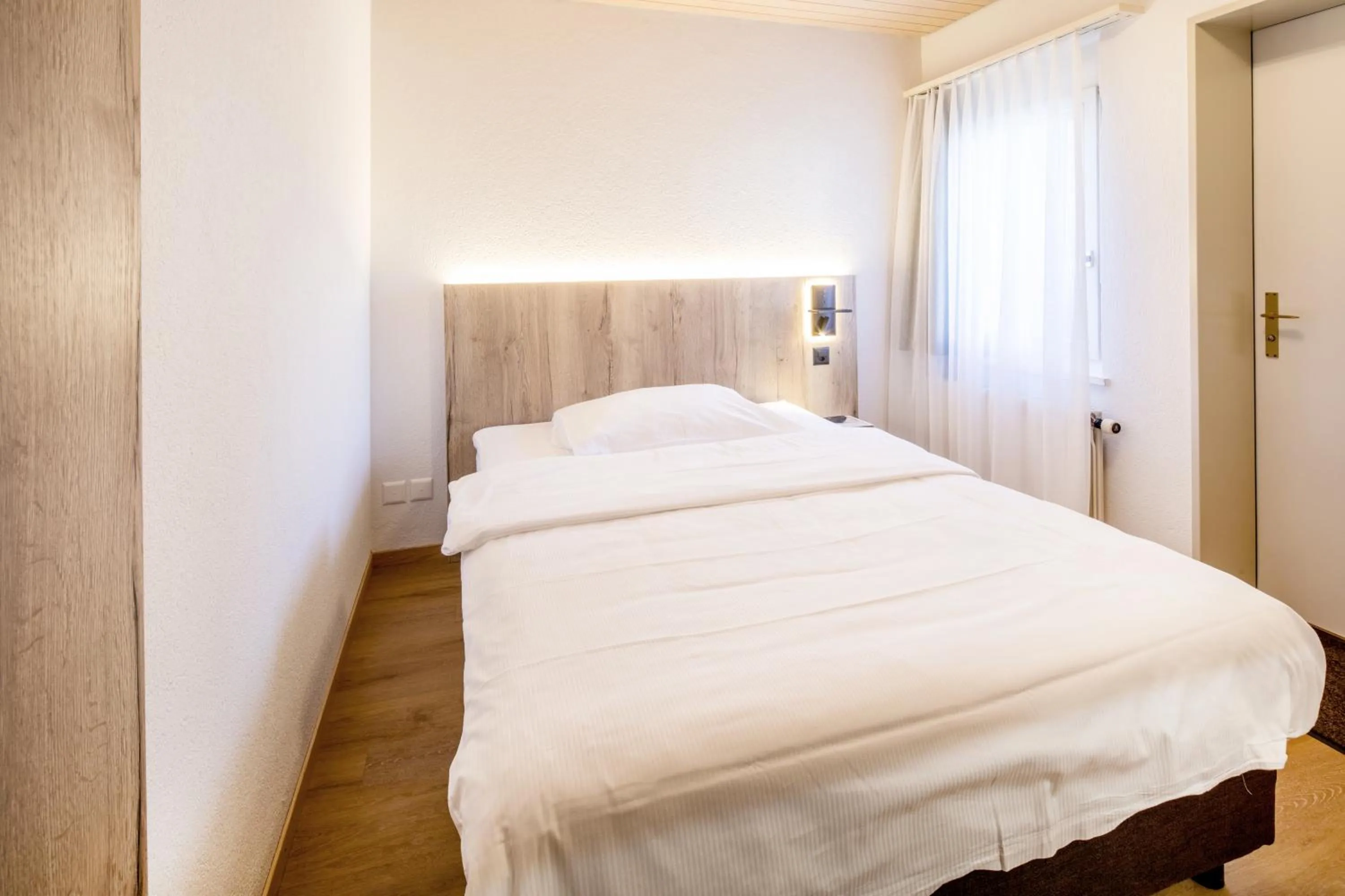 Bed in Gasthof Enge Self Check-In Hotel