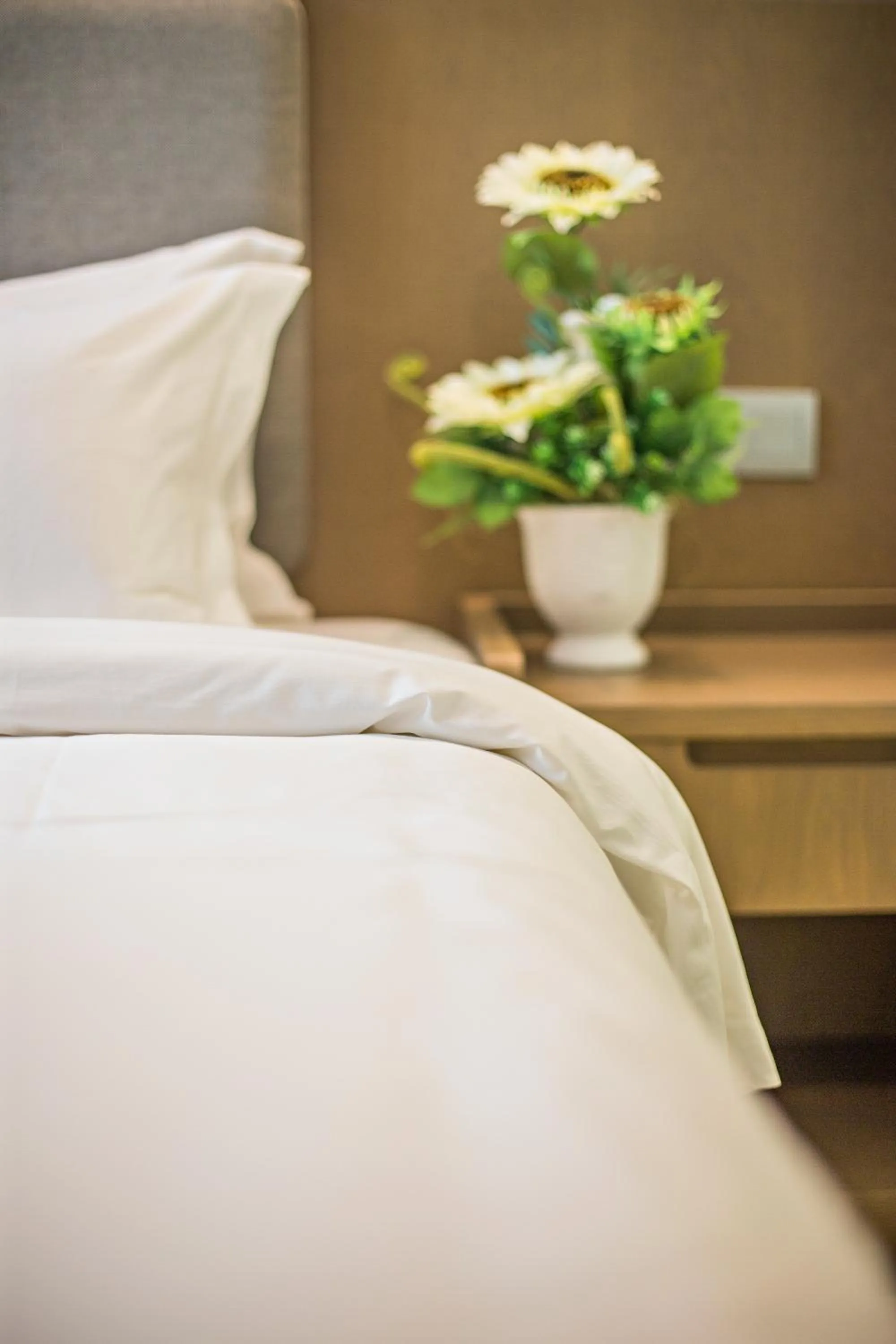 Bed in GRAND FLORA HOTEL