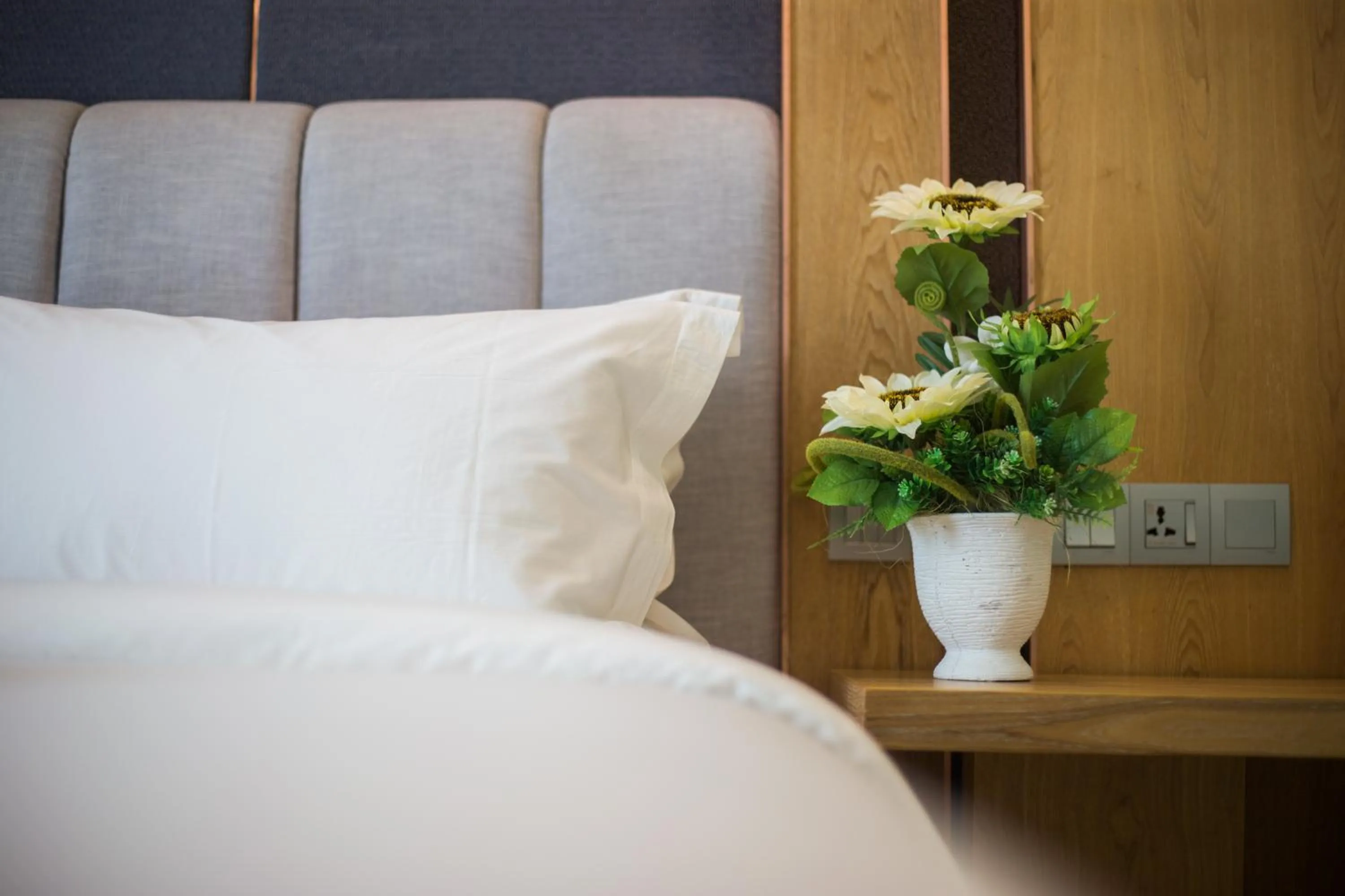 Bed in GRAND FLORA HOTEL