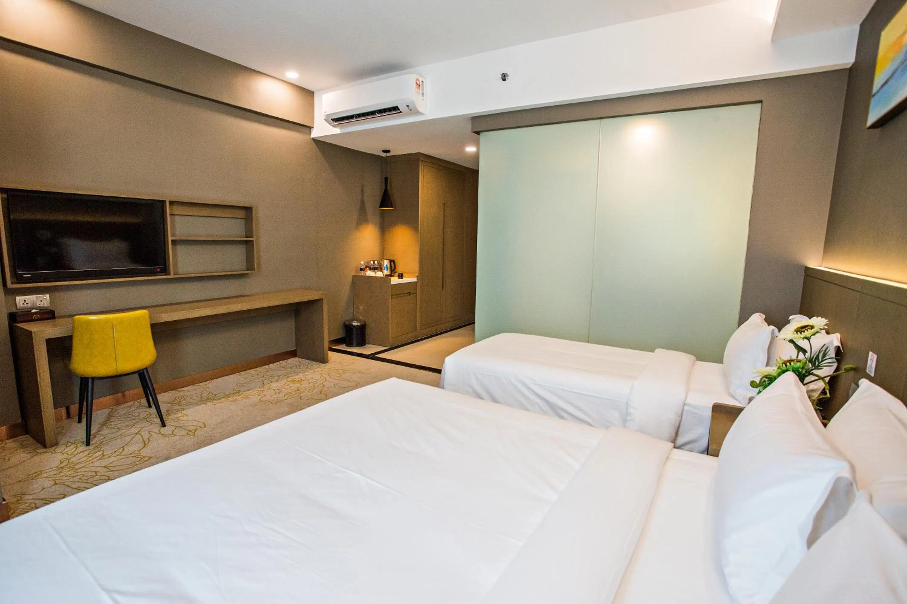 Bed in GRAND FLORA HOTEL