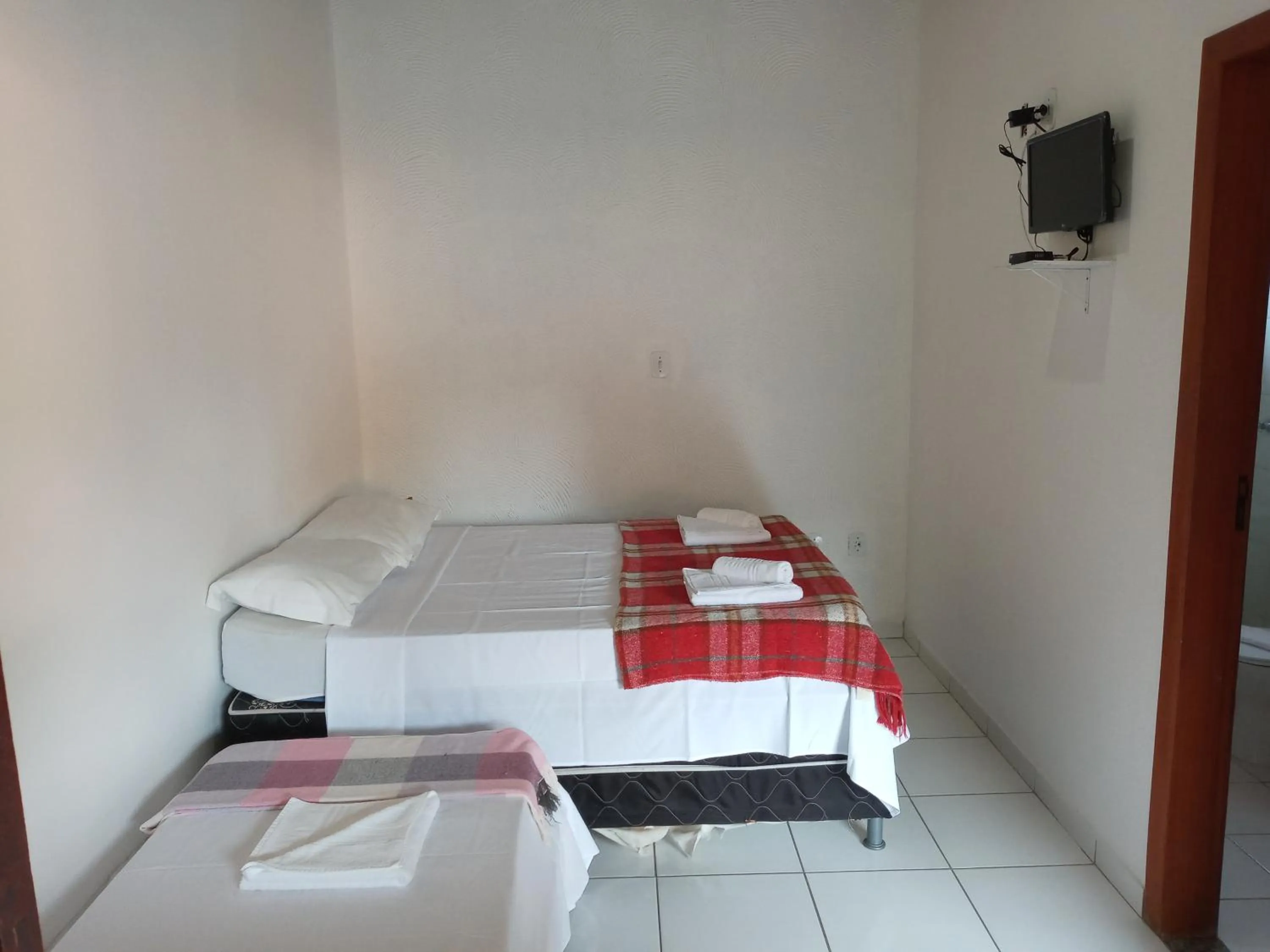 Photo of the whole room, Bed in DORM Olhar da Sereia