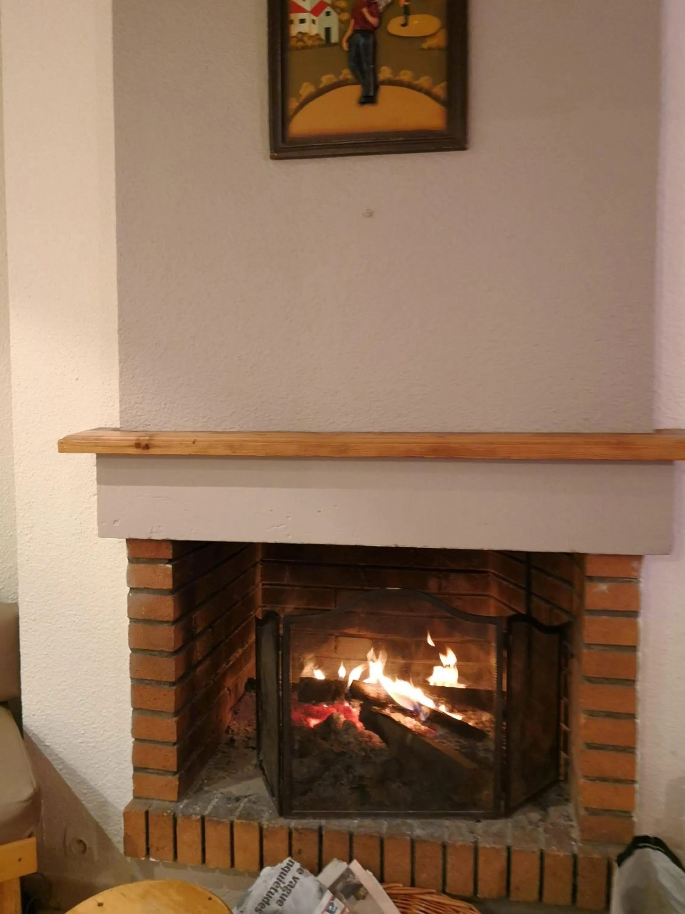 Communal lounge/ TV room in Hôtel Espace Montclar