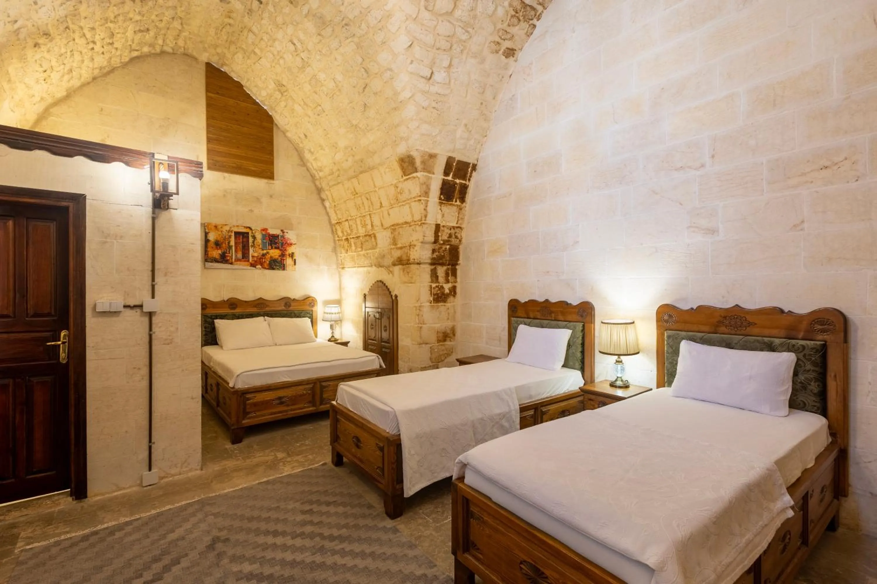 Bed in PALMYRA BOUTIQUE HOTEL