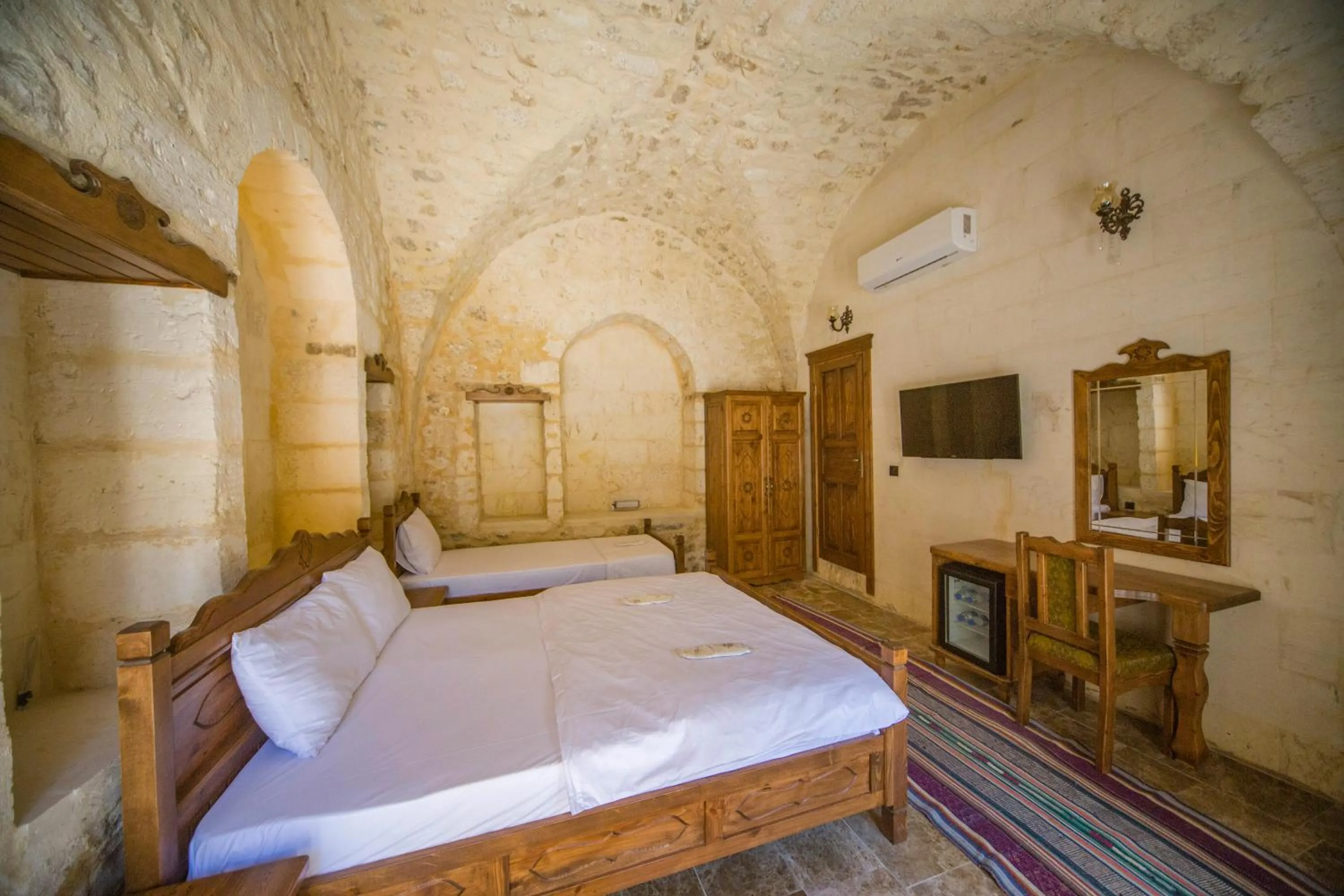 Bed in PALMYRA BOUTIQUE HOTEL