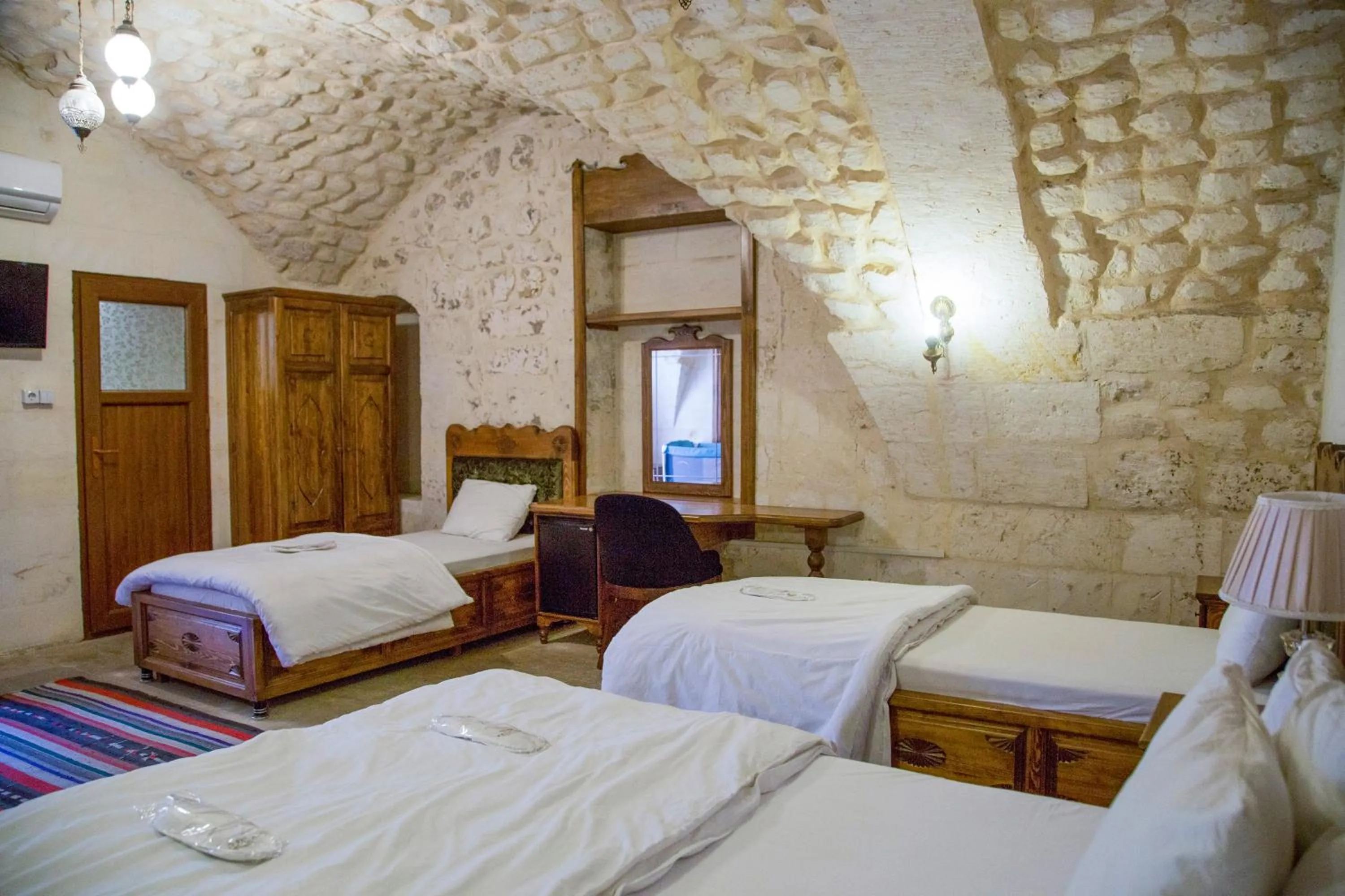 Bed in PALMYRA BOUTIQUE HOTEL