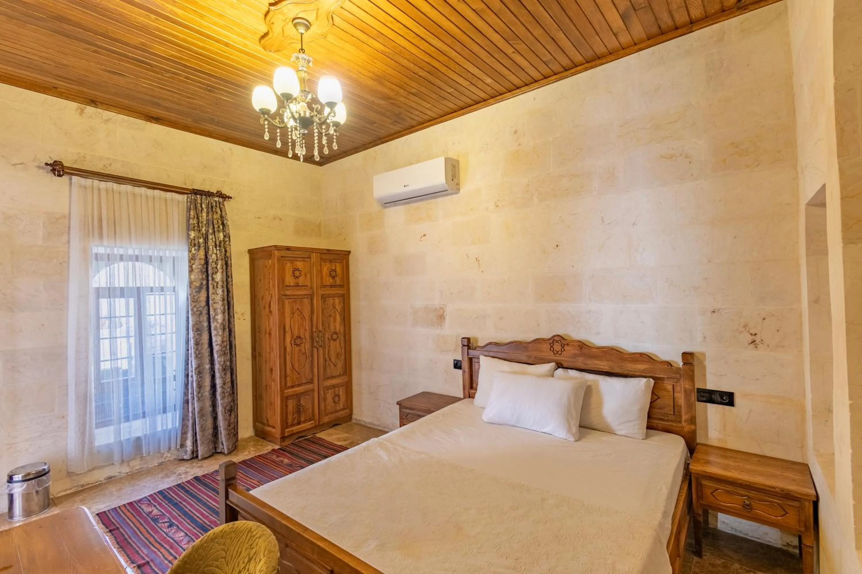 Bed in PALMYRA BOUTIQUE HOTEL