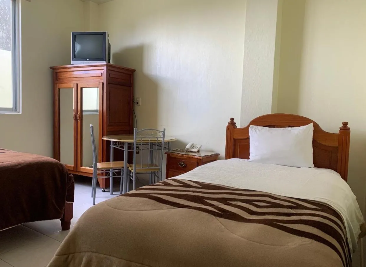 Bed in Hotel Renacimiento