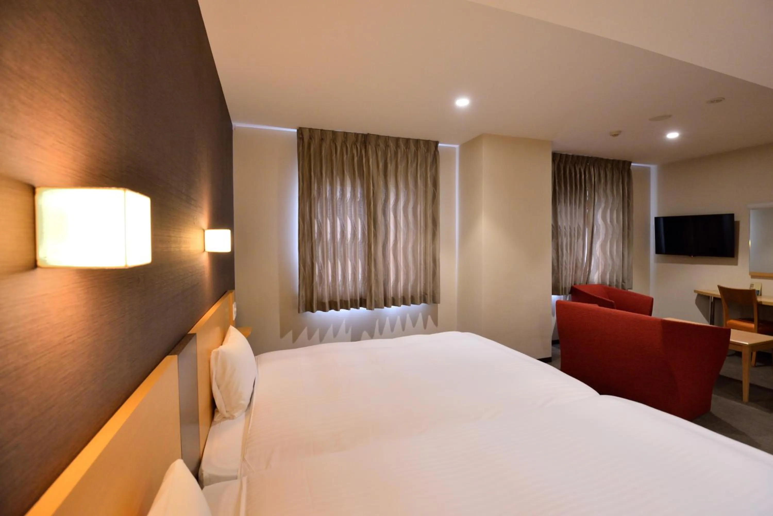 Photo of the whole room, Bed in Hotel Urbic Kagoshima