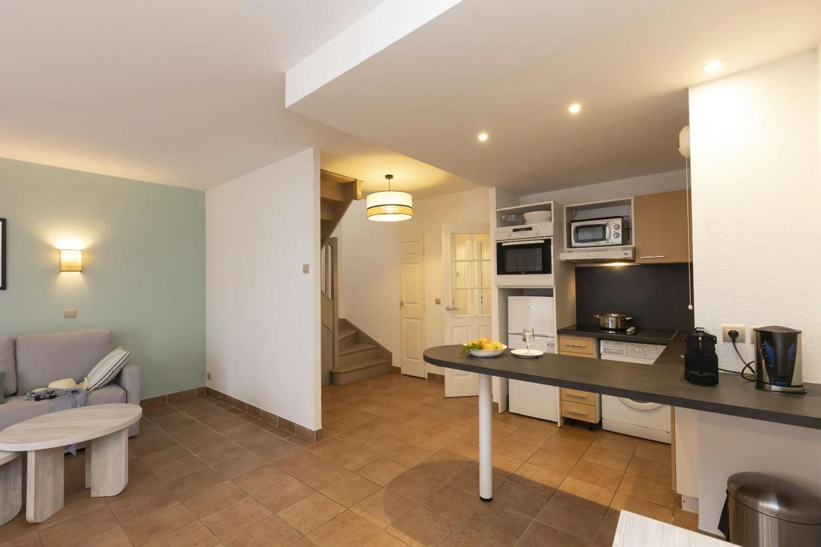 Kitchen or kitchenette in Résidence Odalys Les Greens du Bassin