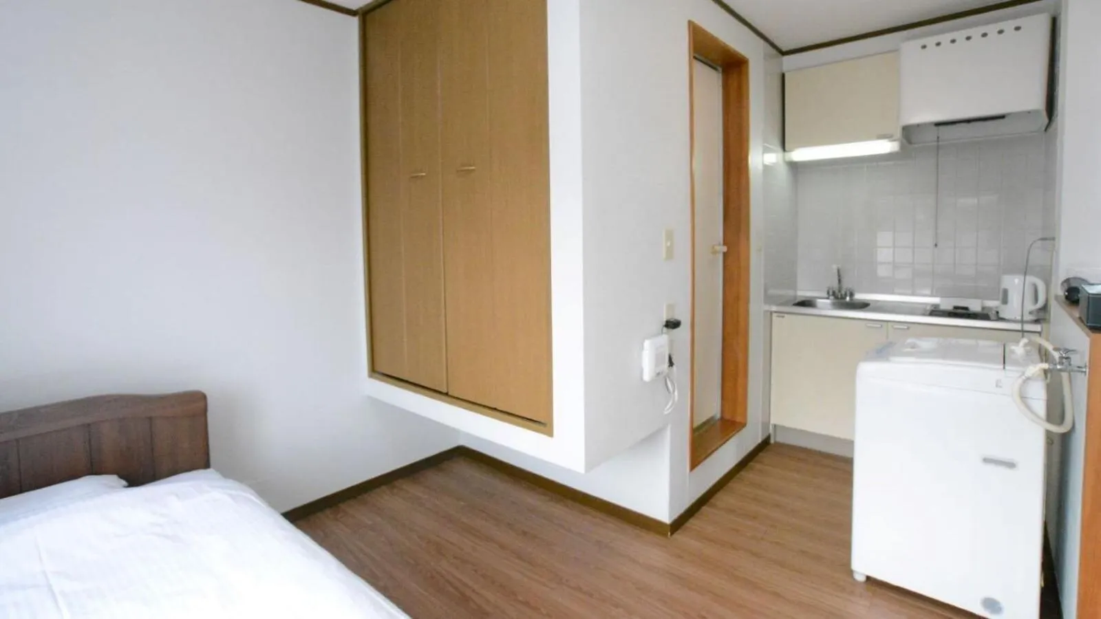 Bed in Tabist Motodai Business Hotel Kanonji