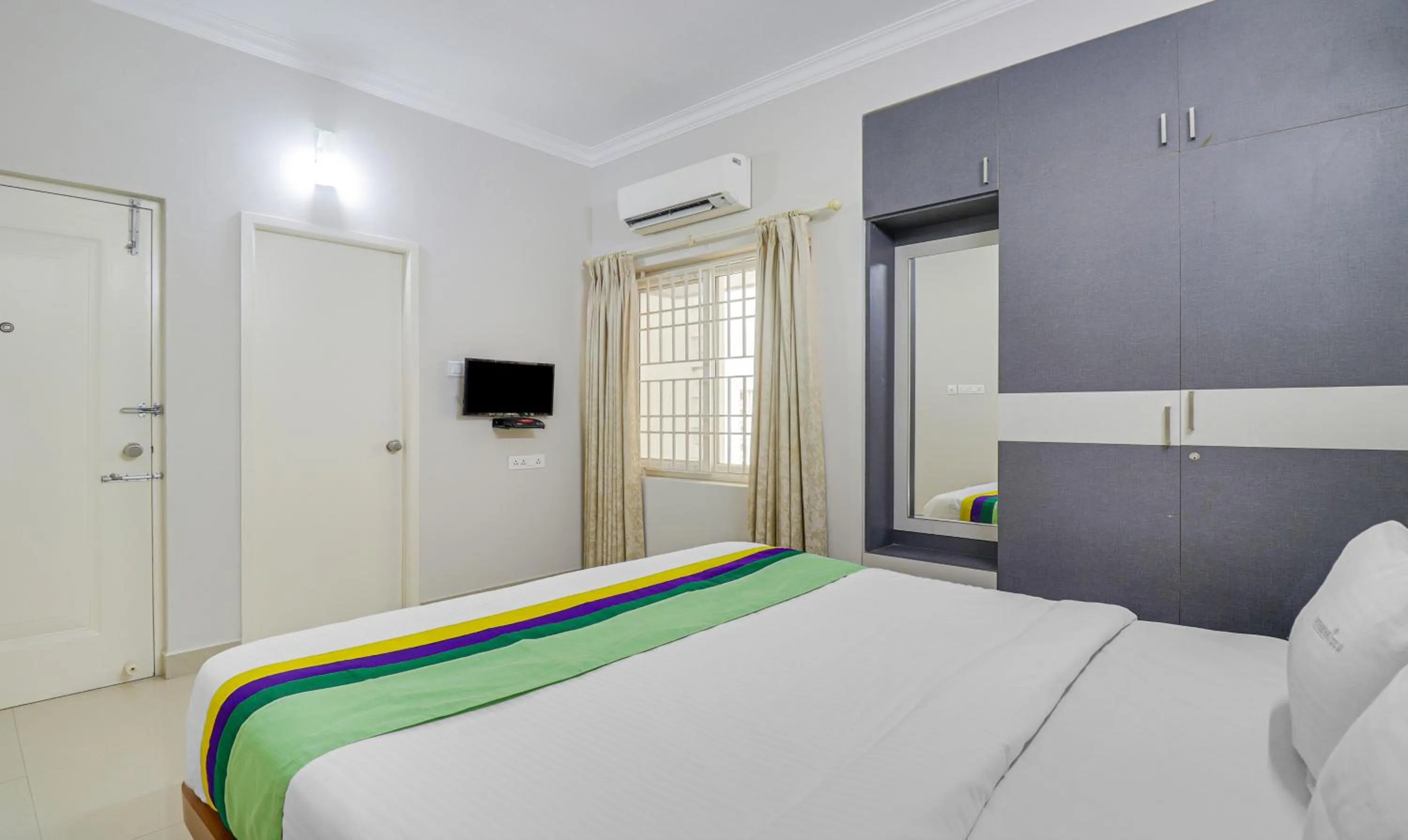 Bedroom, Bed in Treebo Rithikha Inn Elite Chennai Trade Centre