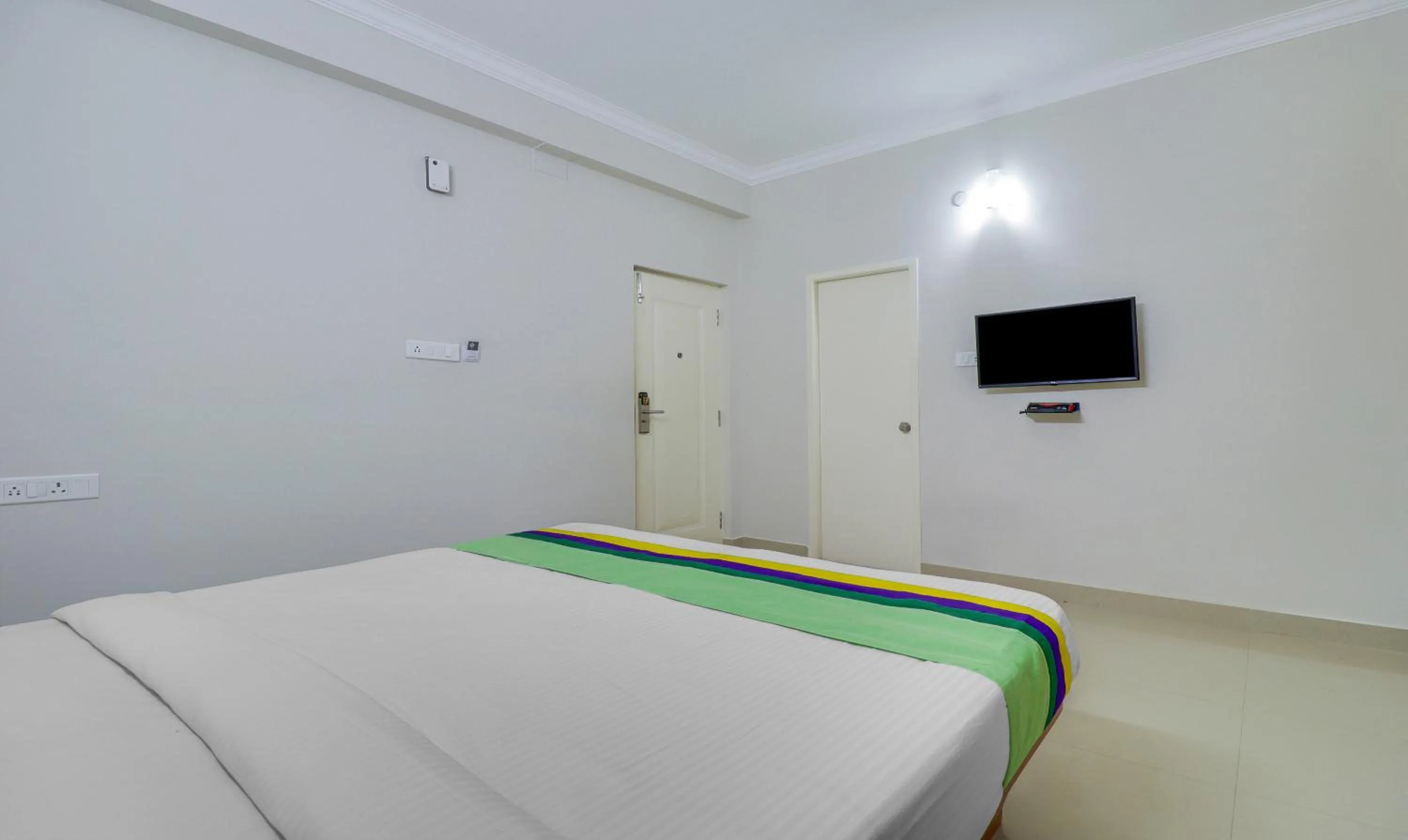 Bedroom, Bed in Treebo Rithikha Inn Elite Chennai Trade Centre