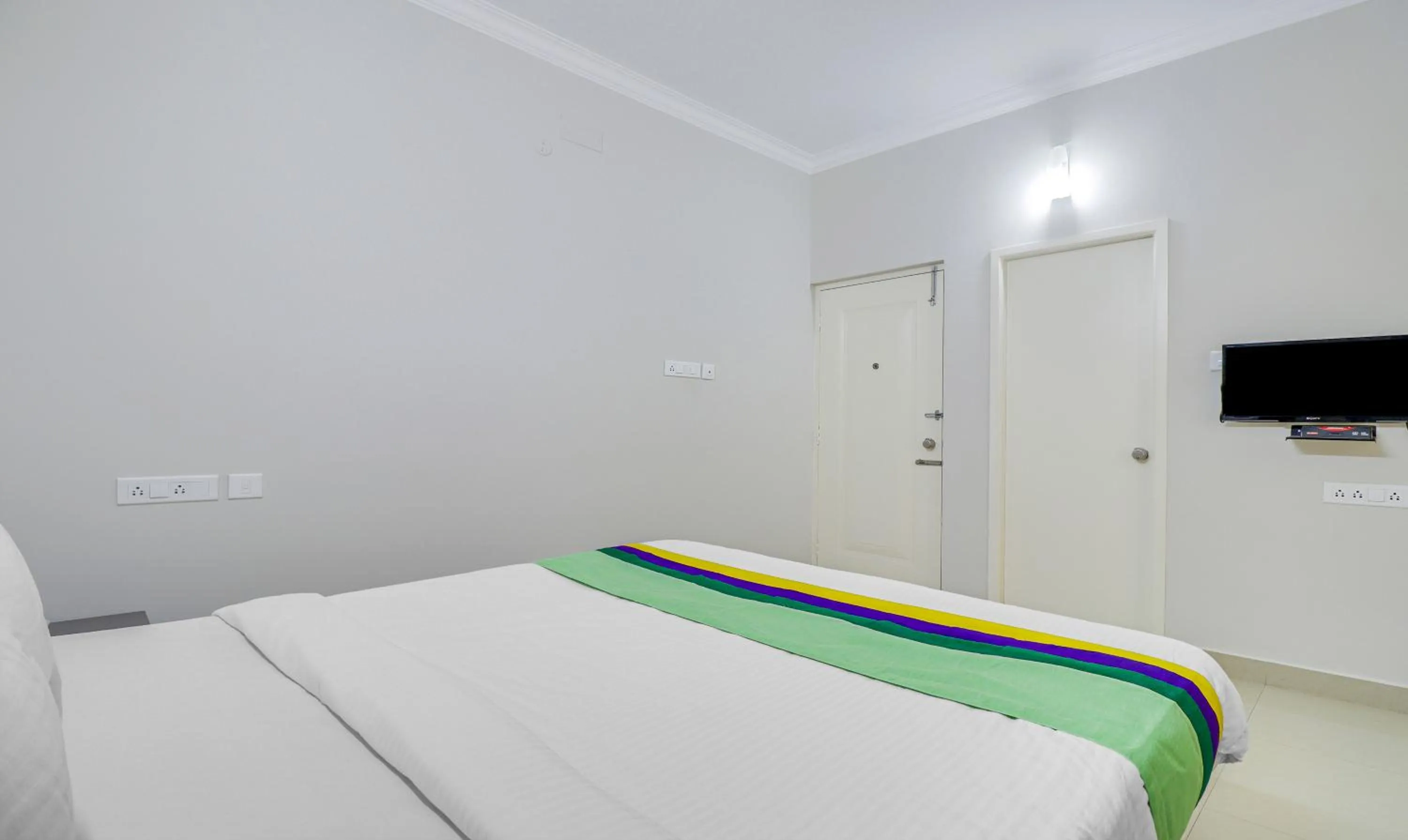 Bedroom, Bed in Treebo Rithikha Inn Elite Chennai Trade Centre