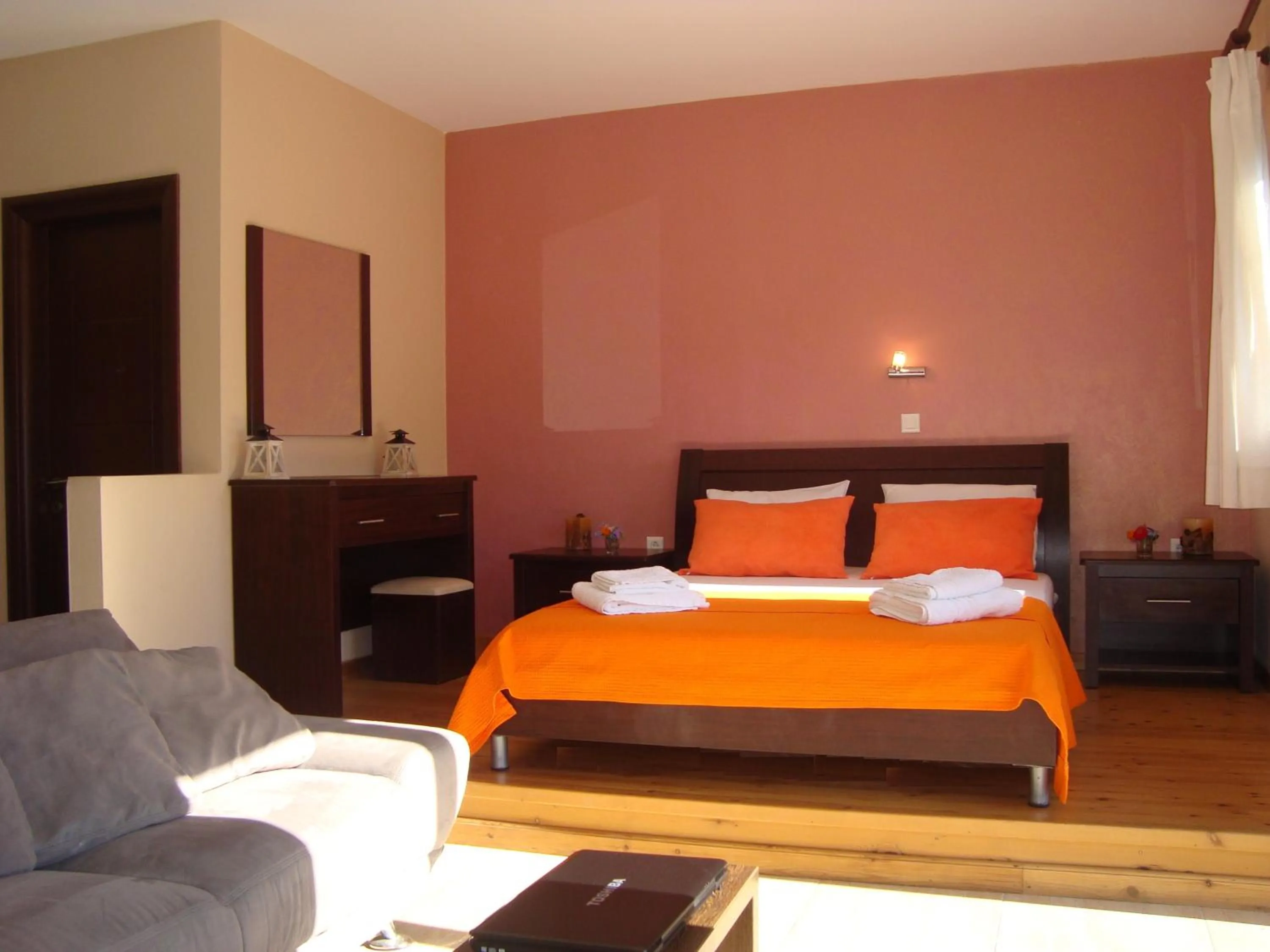 Bed in Mikros Gialos Apartments