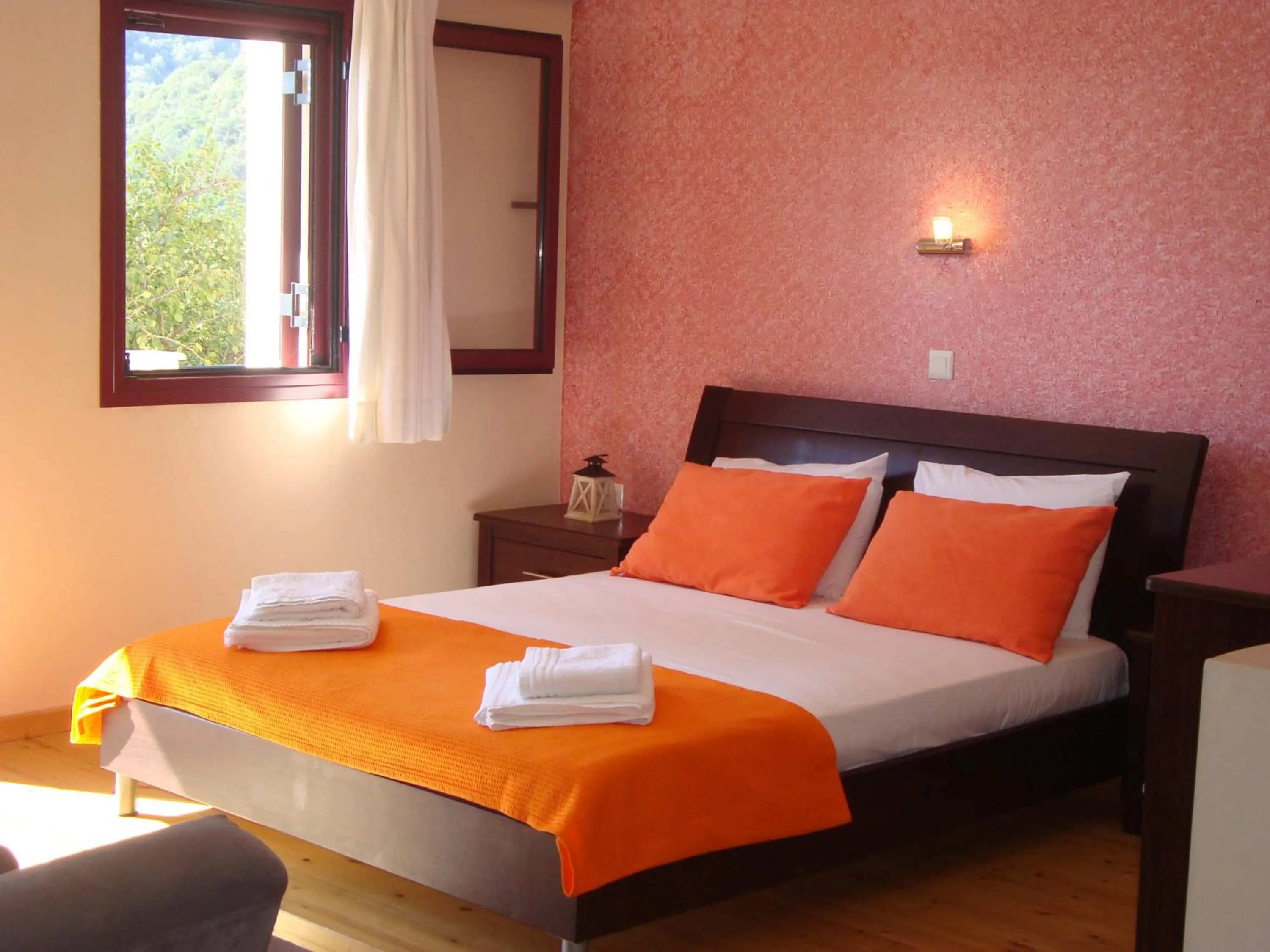 Bed in Mikros Gialos Apartments