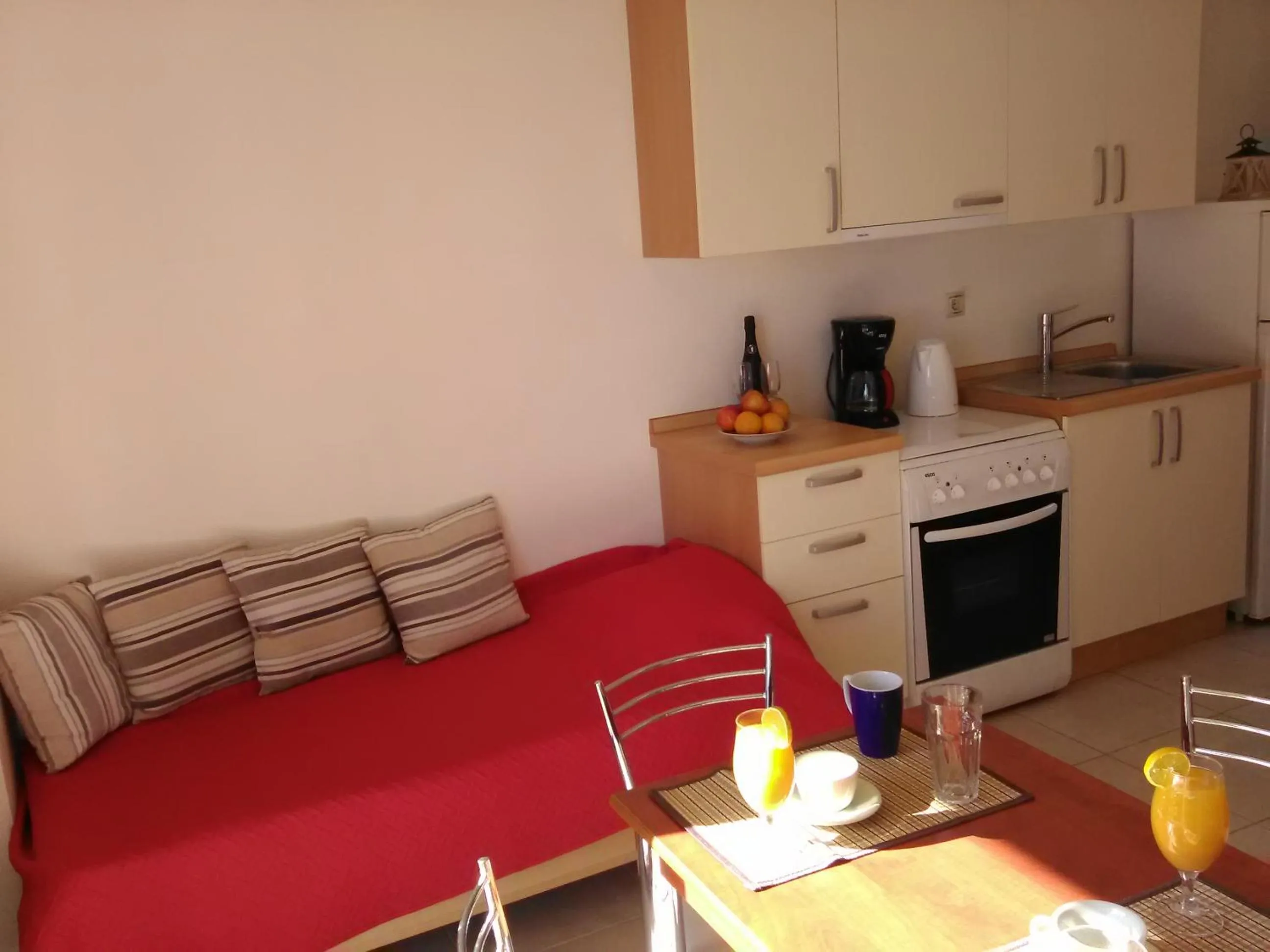 Bed in Mikros Gialos Apartments