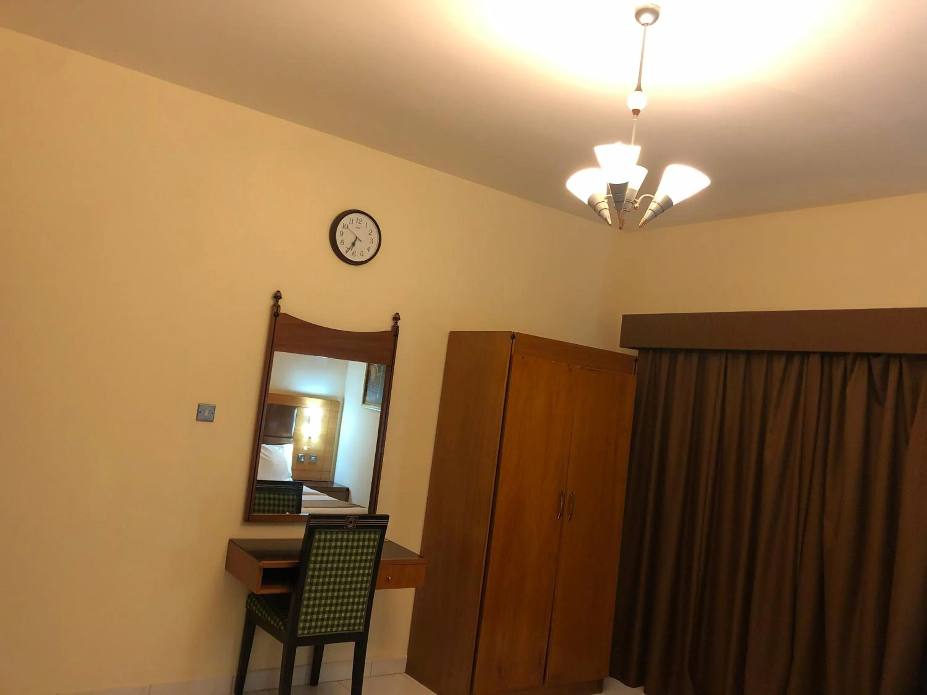 Bed in New Royal Mark Hotel Apartments