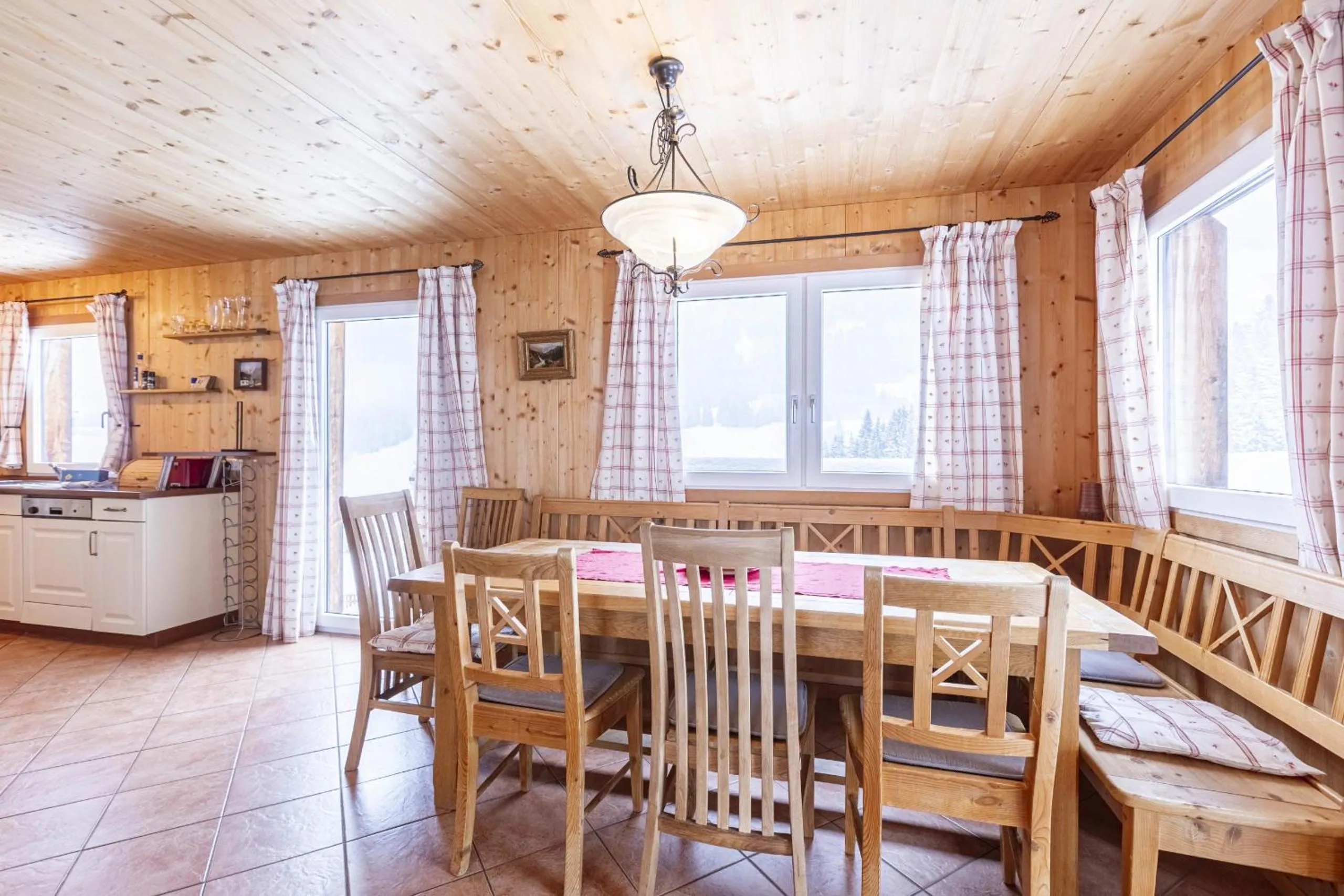 Dining area in Alpendorf Dachstein West by ALPS RESORTS