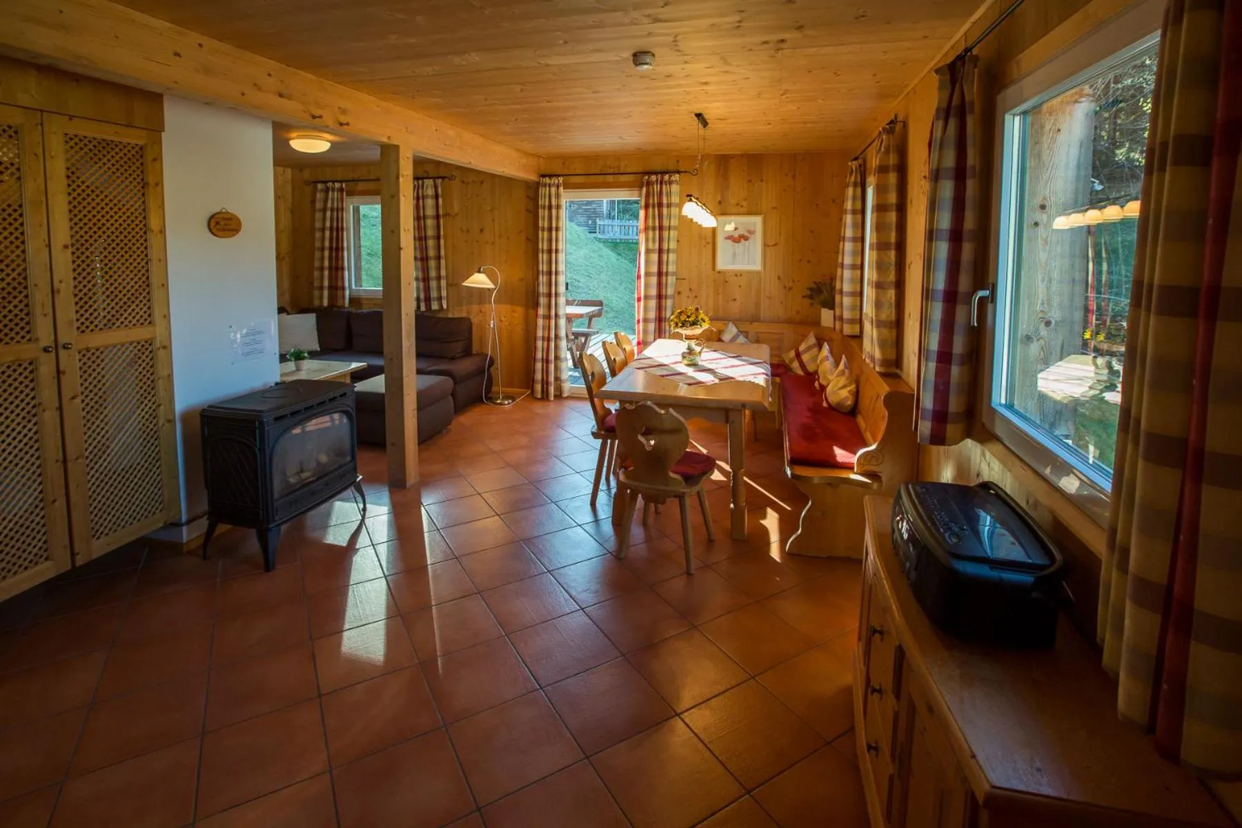 Living room in Alpendorf Dachstein West by ALPS RESORTS