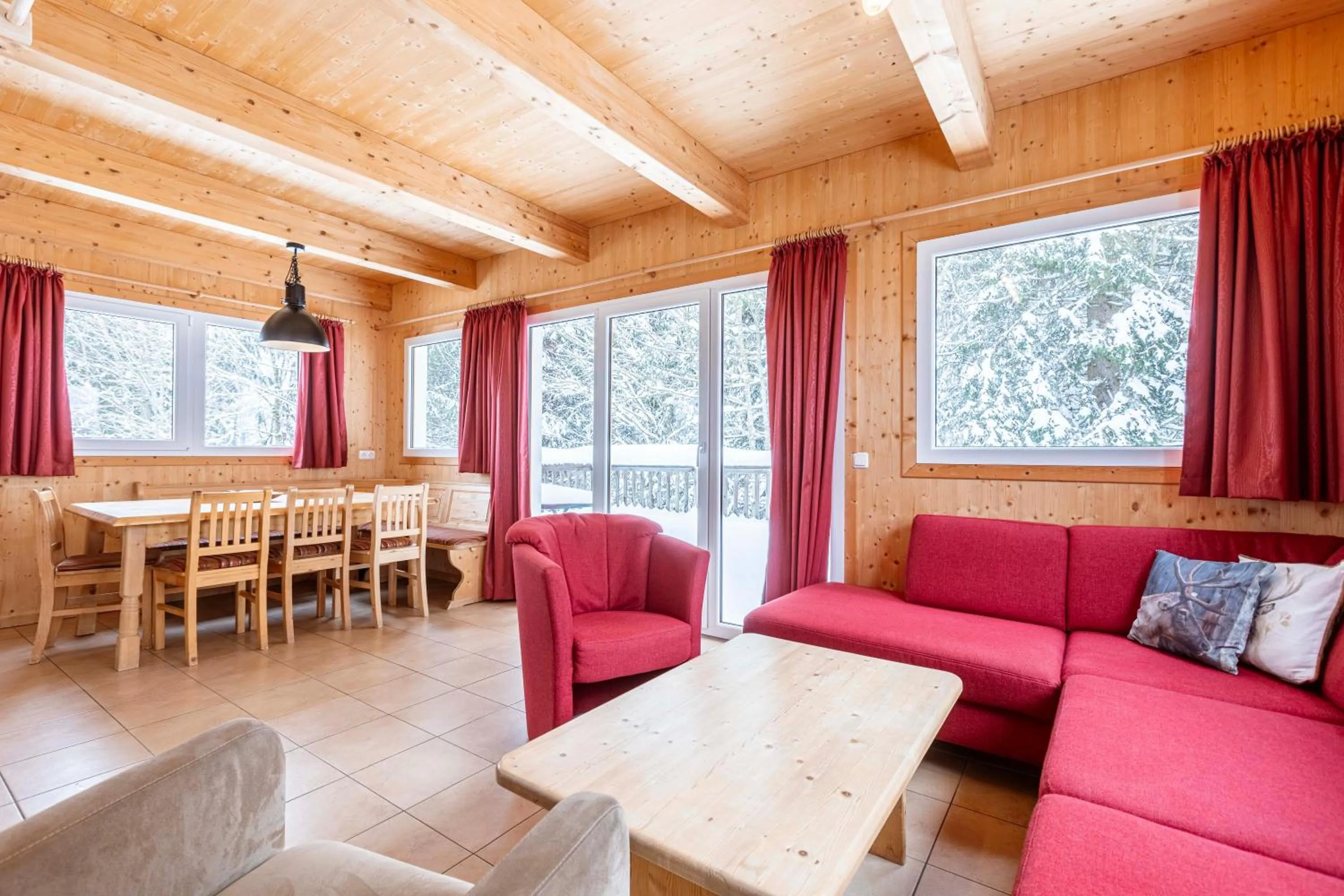 Living room in Alpendorf Dachstein West by ALPS RESORTS