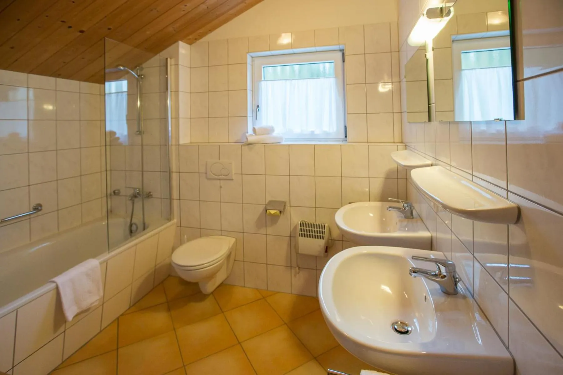 Bathroom in Alpendorf Dachstein West by ALPS RESORTS