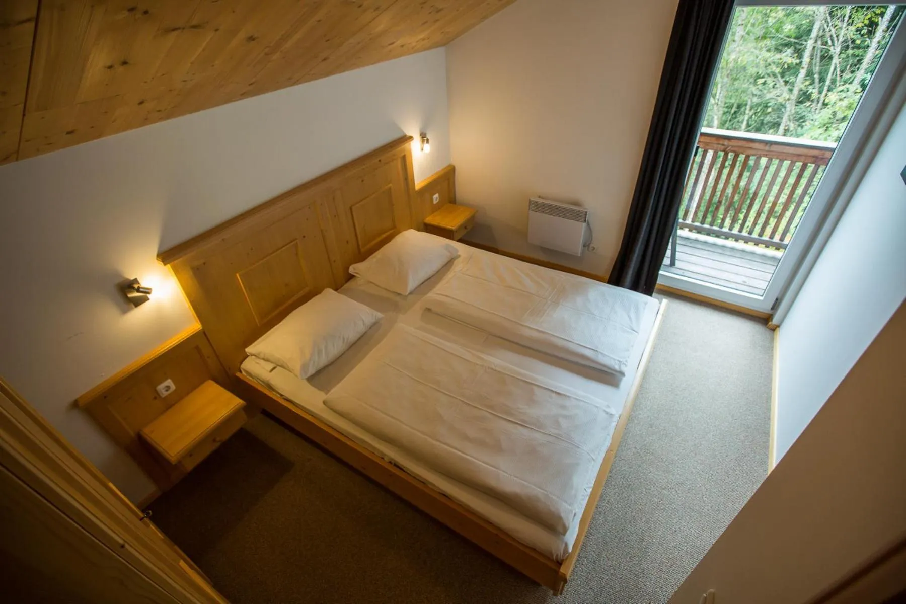 Bedroom, Bed in Alpendorf Dachstein West by ALPS RESORTS