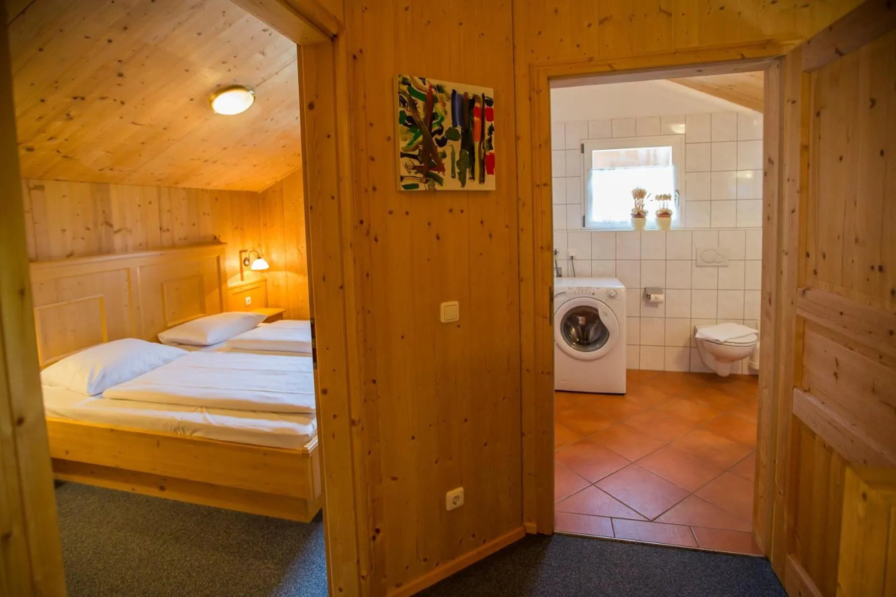 Bathroom, Bed in Alpendorf Dachstein West by ALPS RESORTS