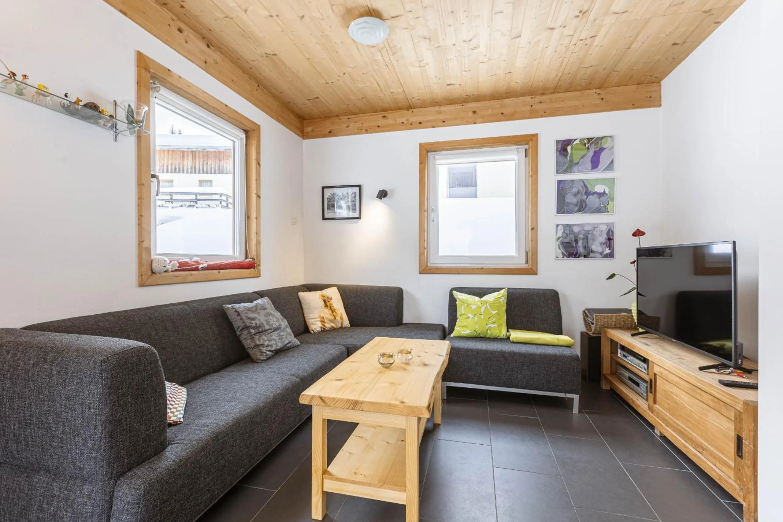 Living room in Alpendorf Dachstein West by ALPS RESORTS