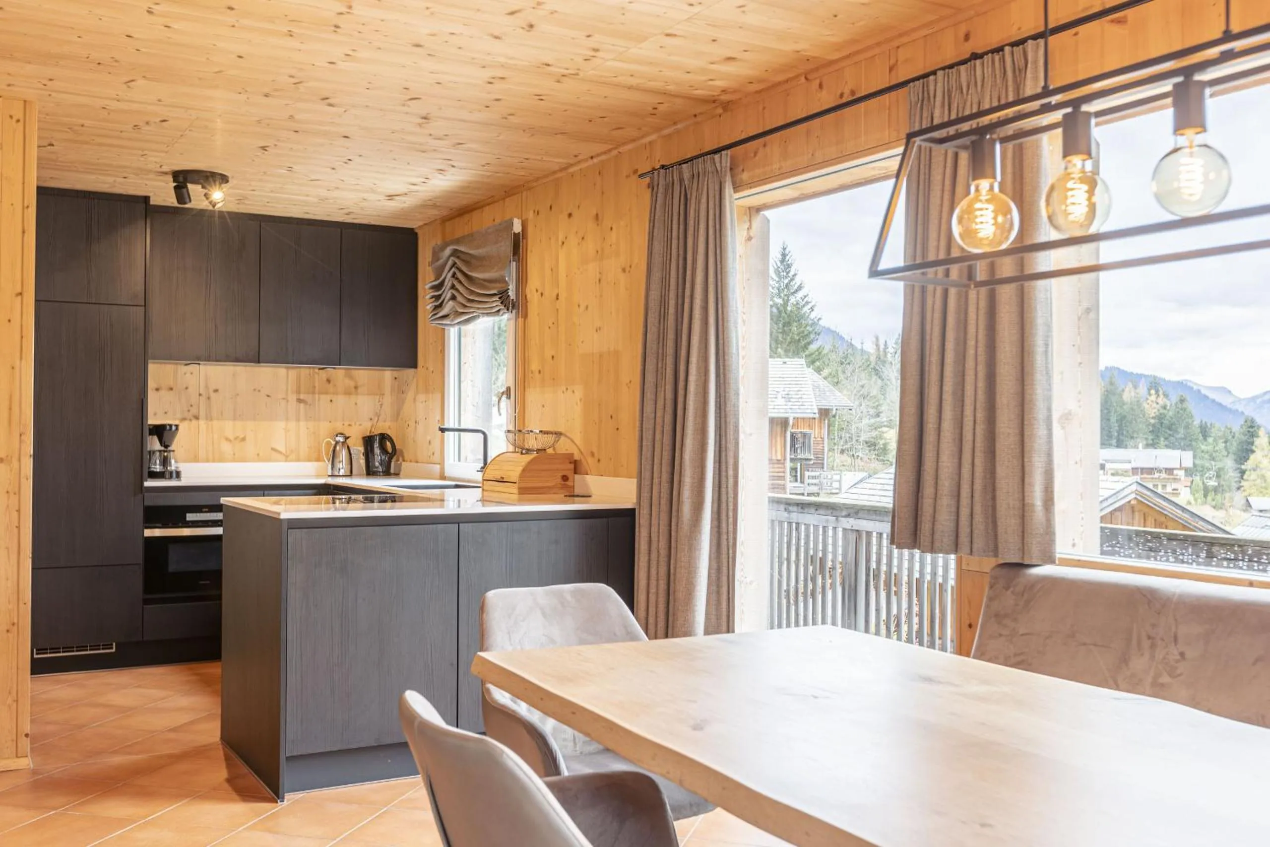 Kitchen or kitchenette in Alpendorf Dachstein West by ALPS RESORTS