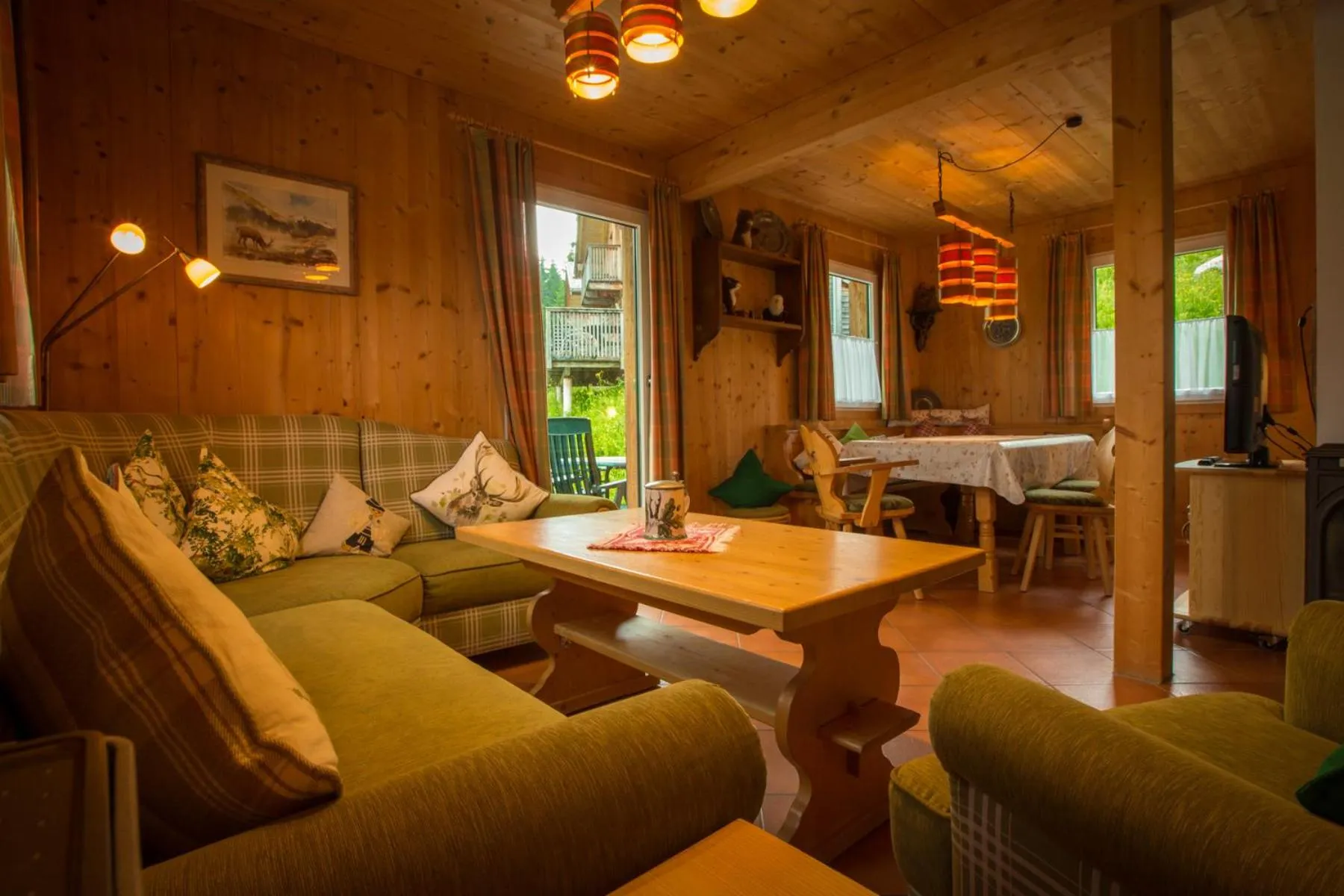 Living room in Alpendorf Dachstein West by ALPS RESORTS