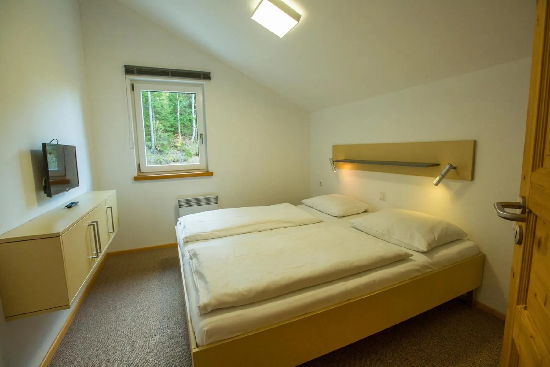 Bedroom, Bed in Alpendorf Dachstein West by ALPS RESORTS