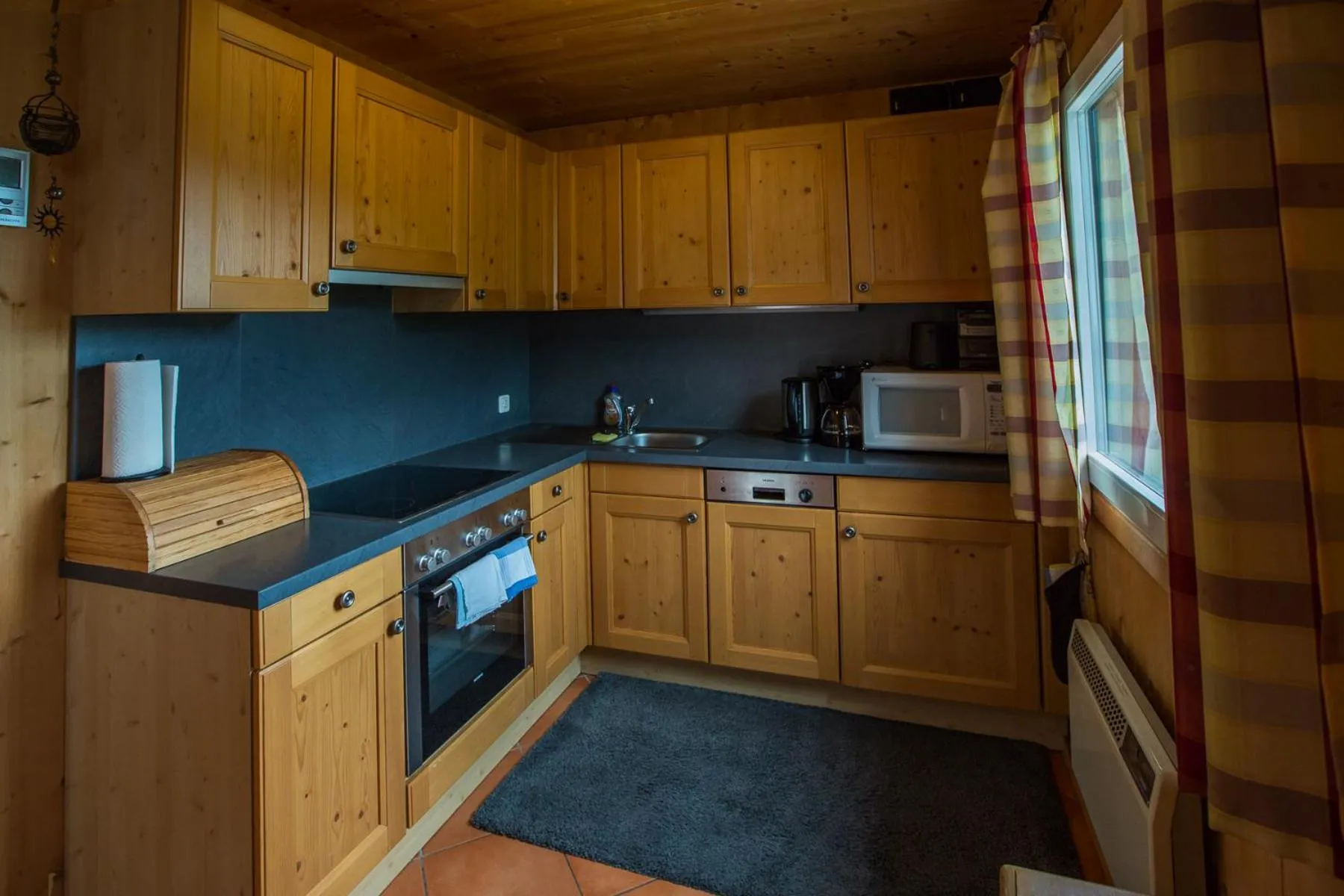 Kitchen or kitchenette in Alpendorf Dachstein West by ALPS RESORTS