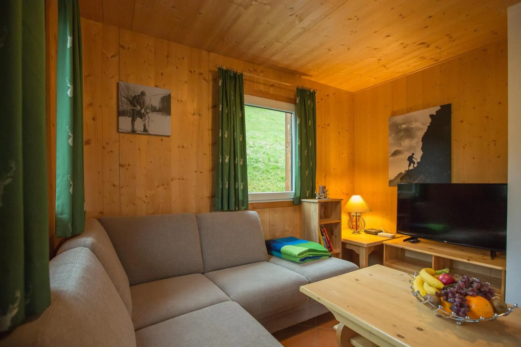 Living room in Alpendorf Dachstein West by ALPS RESORTS