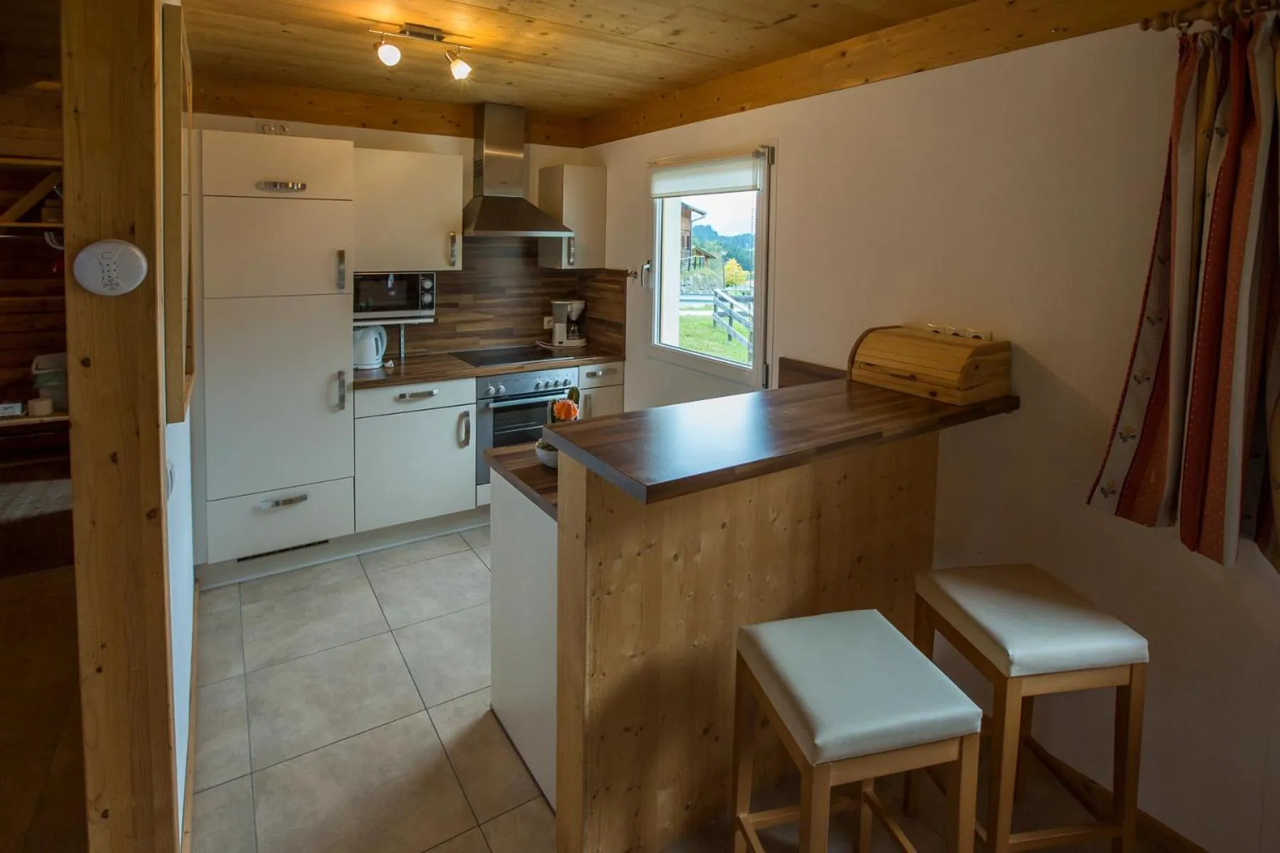 Kitchen or kitchenette in Alpendorf Dachstein West by ALPS RESORTS