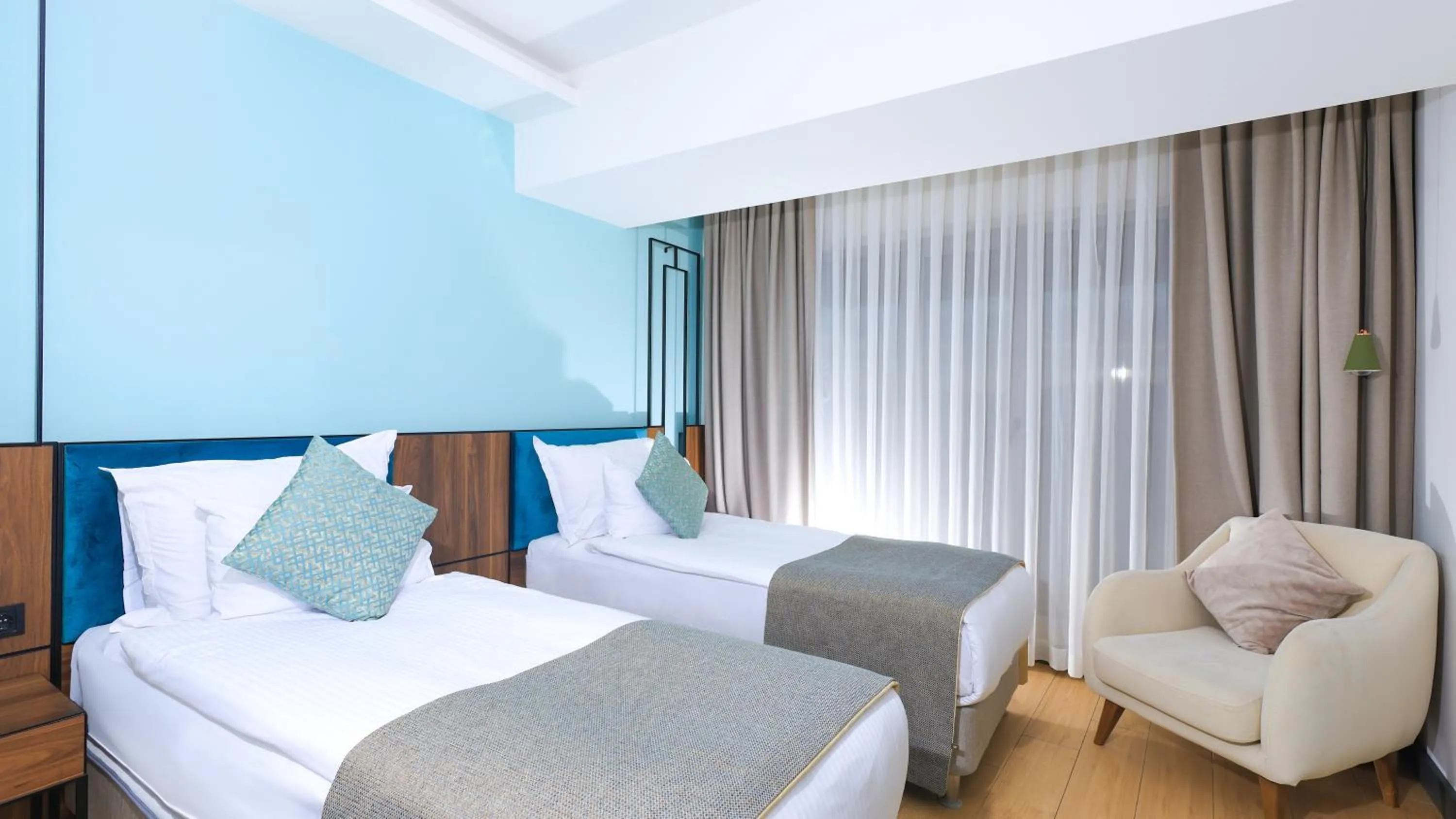 Bed in Leaf Port Hotel