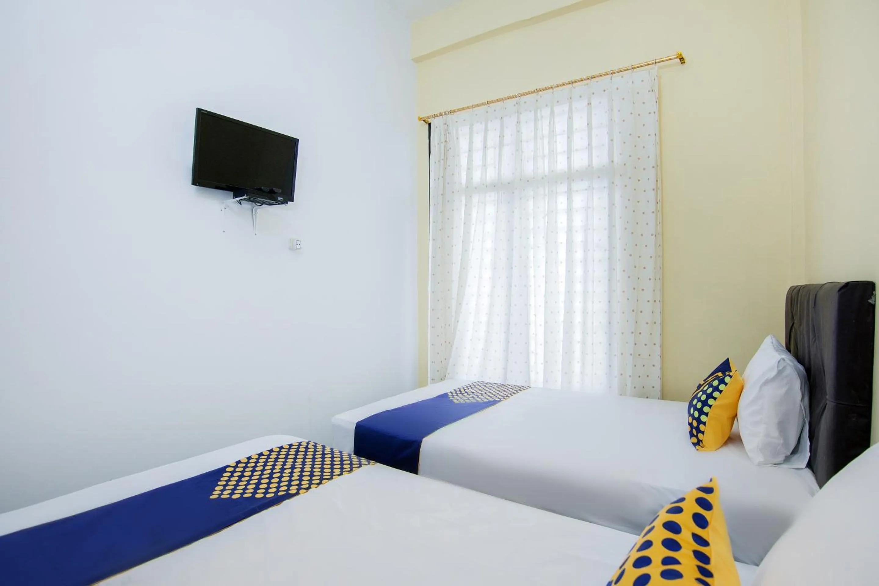 Bedroom, Bed in SPOT ON 2076 Hotel Stadion