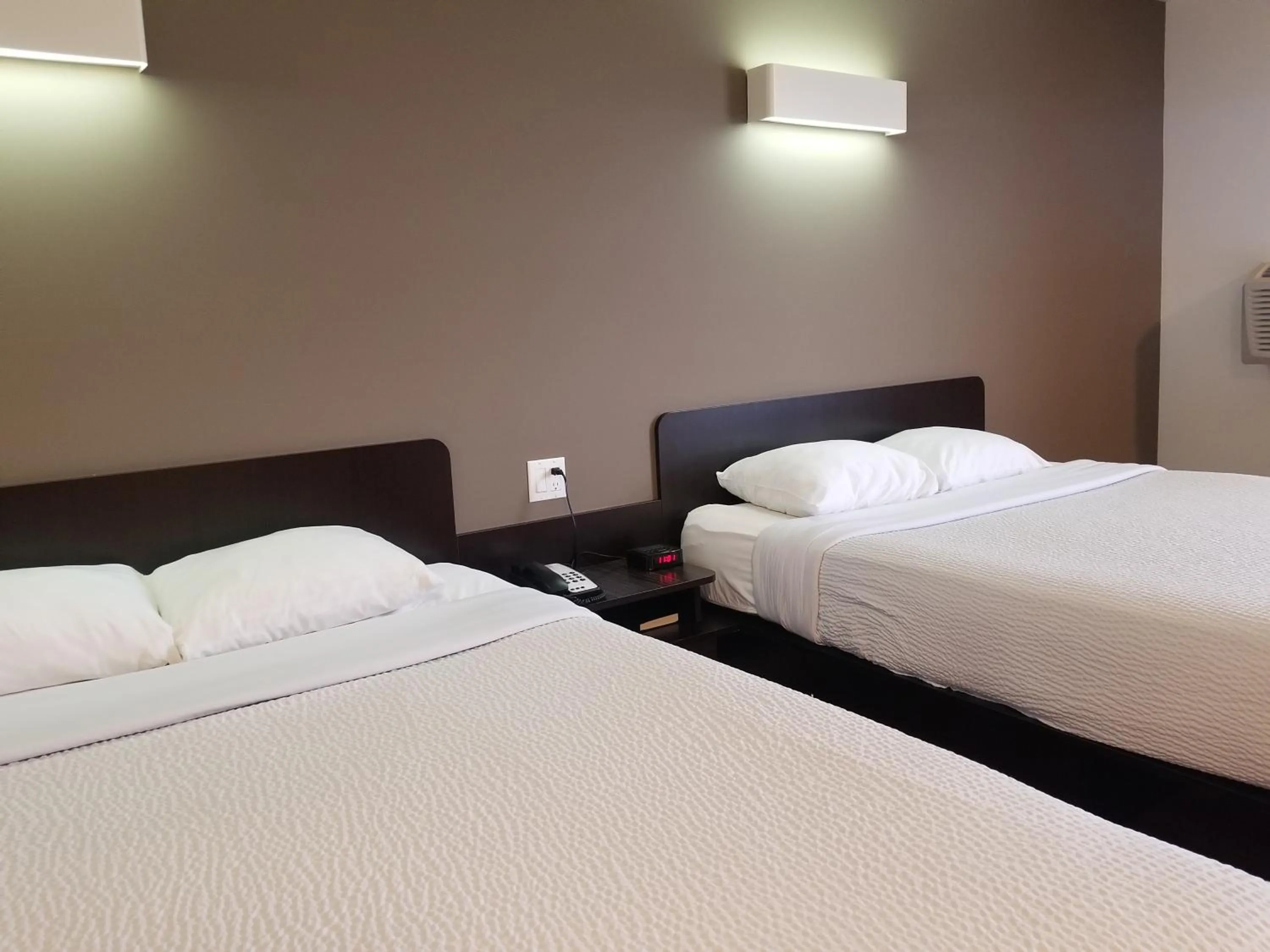 Bed in Joys Inn Innisfail, AB