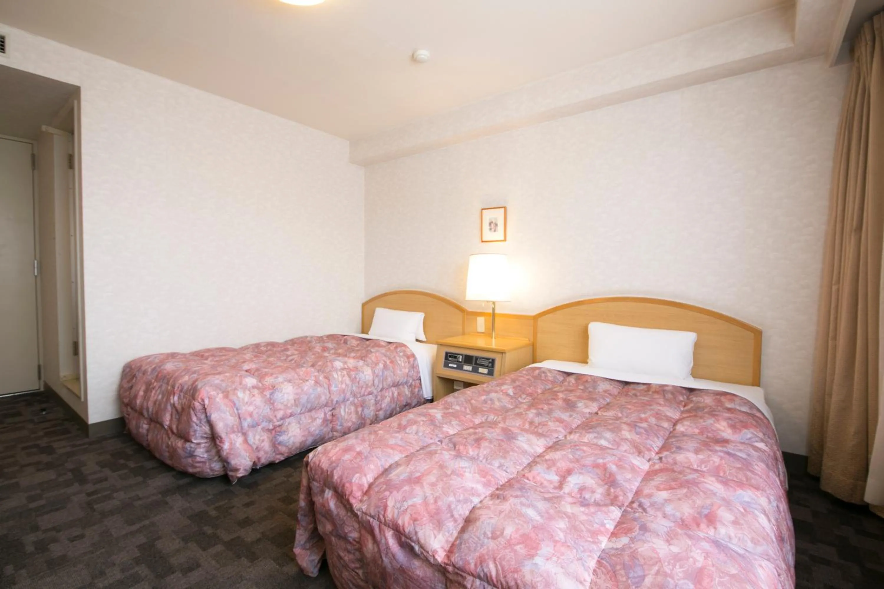 Bed in Kuwana Green Hotel