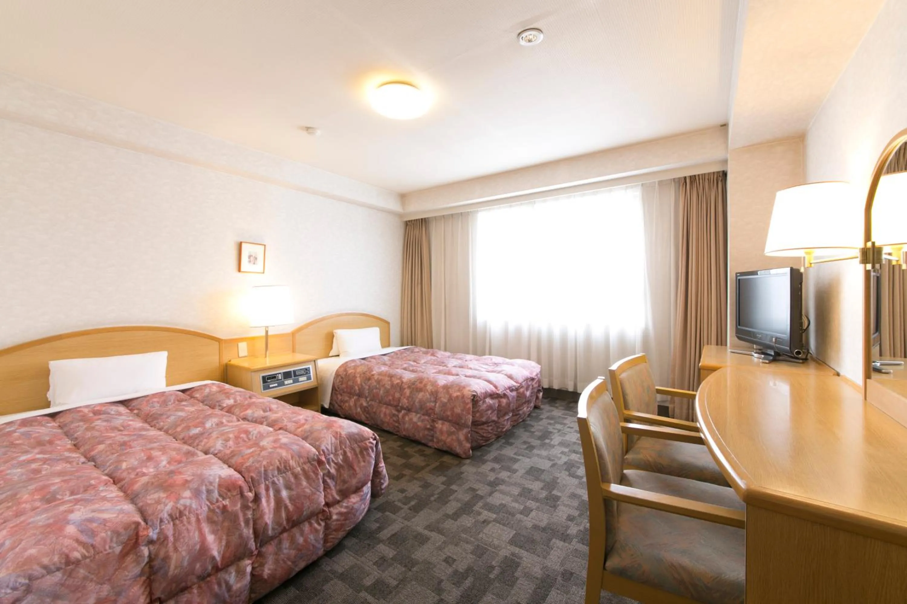 Bed in Kuwana Green Hotel