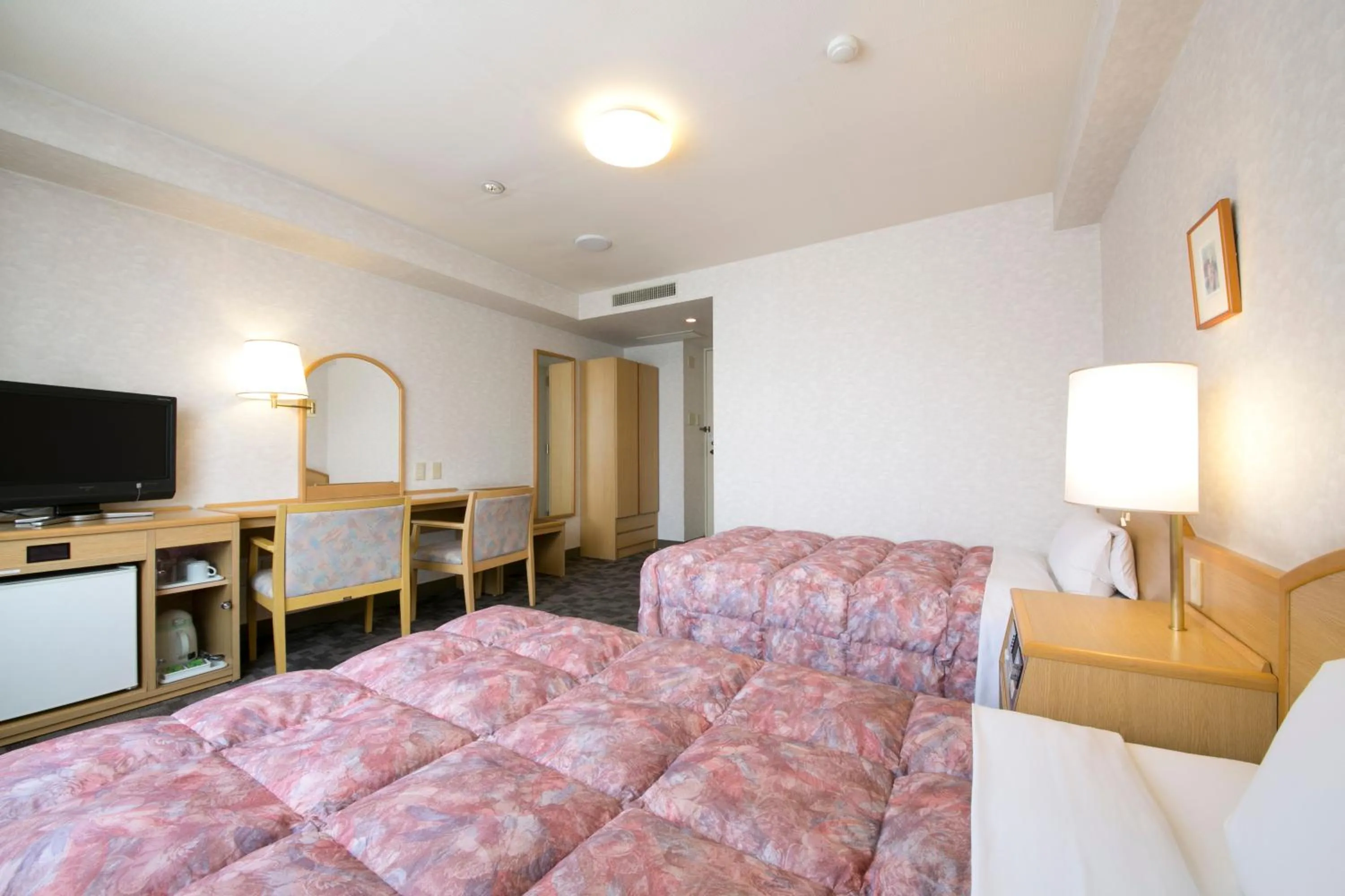 Bed in Kuwana Green Hotel