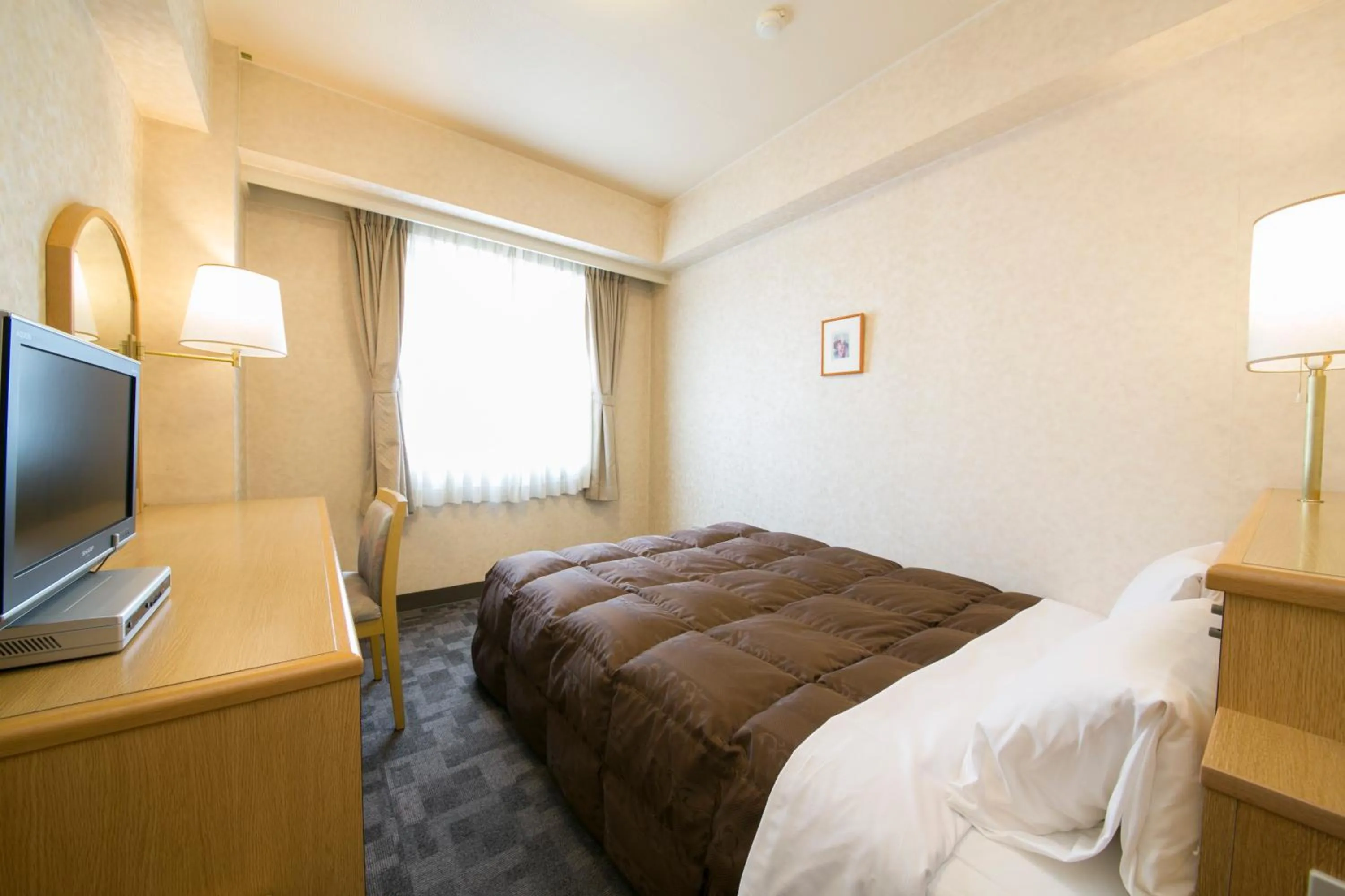 Photo of the whole room, Bed in Kuwana Green Hotel